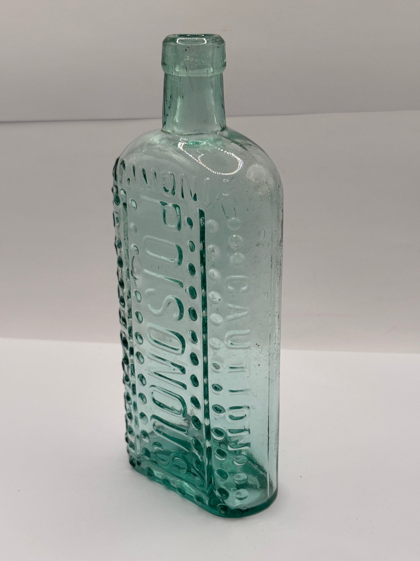 Old aqua glass poison bottle, Ammonia, caution Poisonous, not to be taken