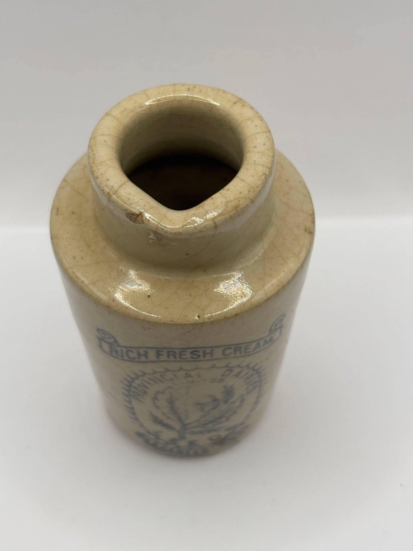Old stoneware advertising cream pot. Provencial dairies Leeds