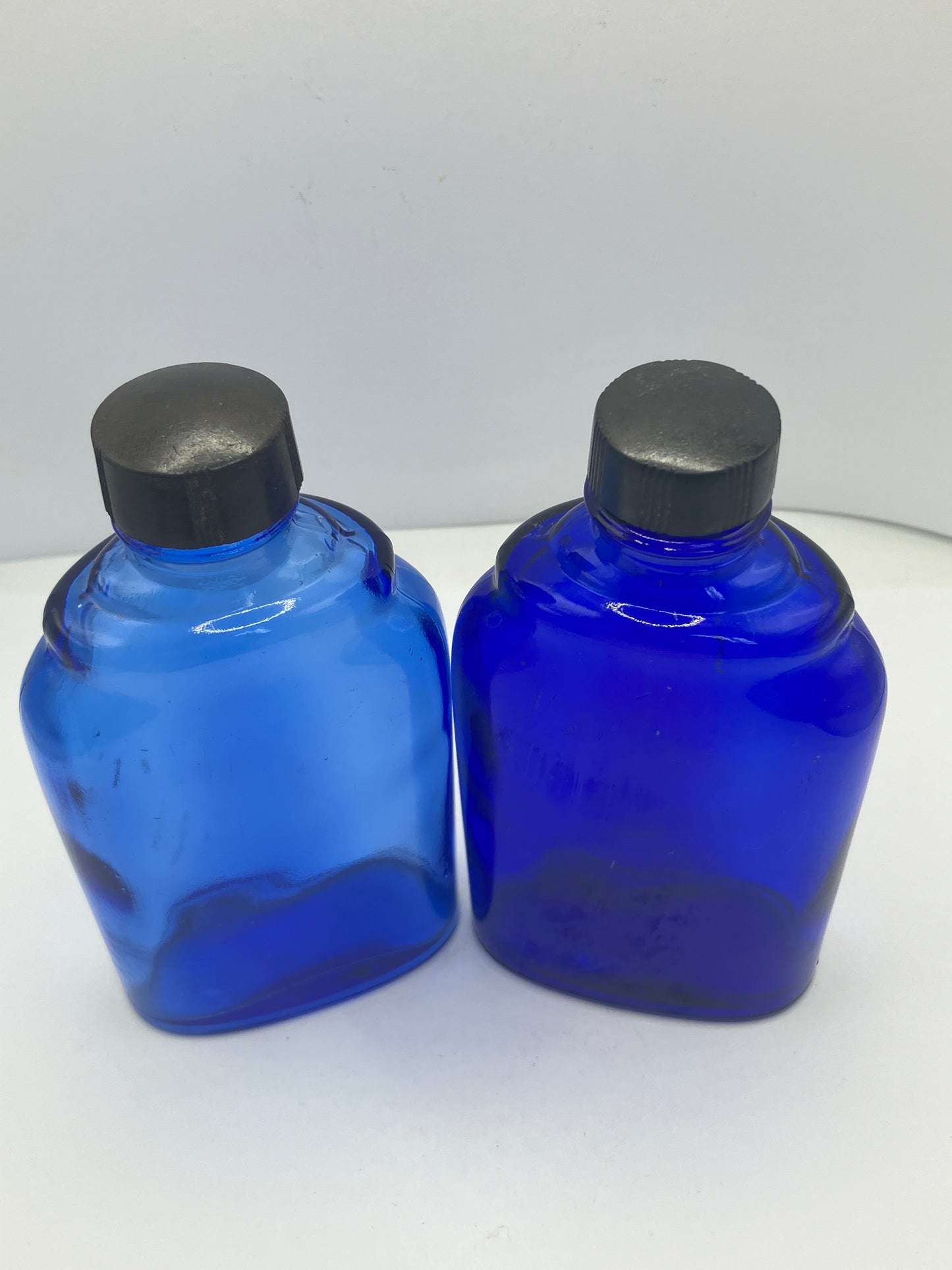 2 blue glass optrex bottles