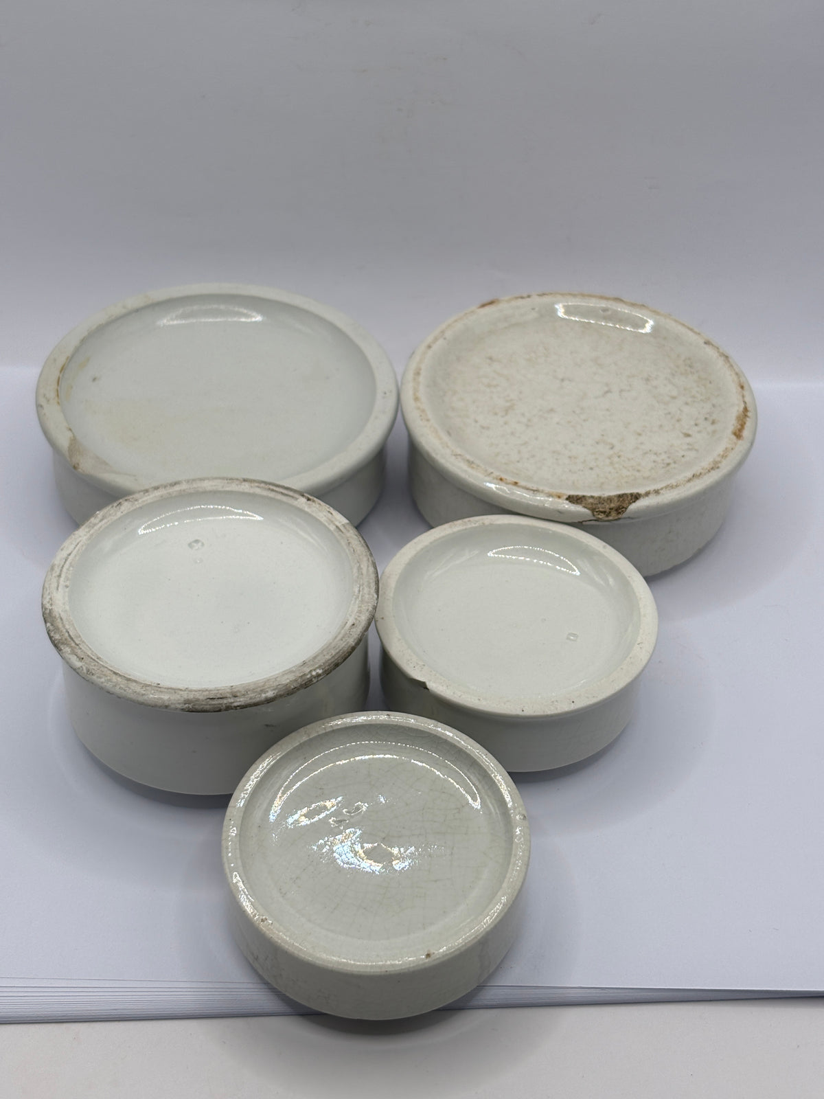 5 old stoneware pot lid bases, stackers (H)
