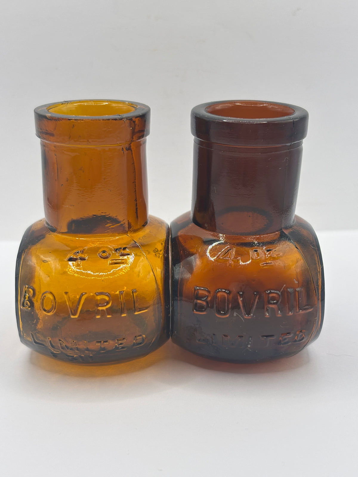 2 old 4Oz amber glass advertising Bovril bottles