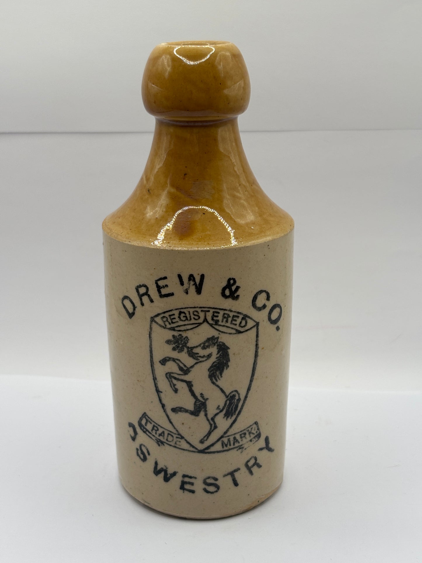 Old stoneware ginger beer bottle, Drew & Co. Oswestry