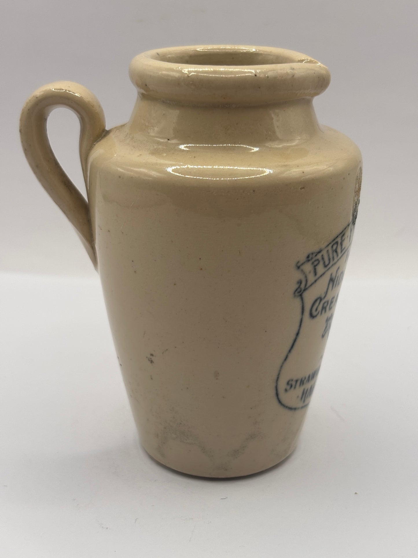 Old advertising cream pot, Nidderdale creameries. Pure fresh cream. Cow print