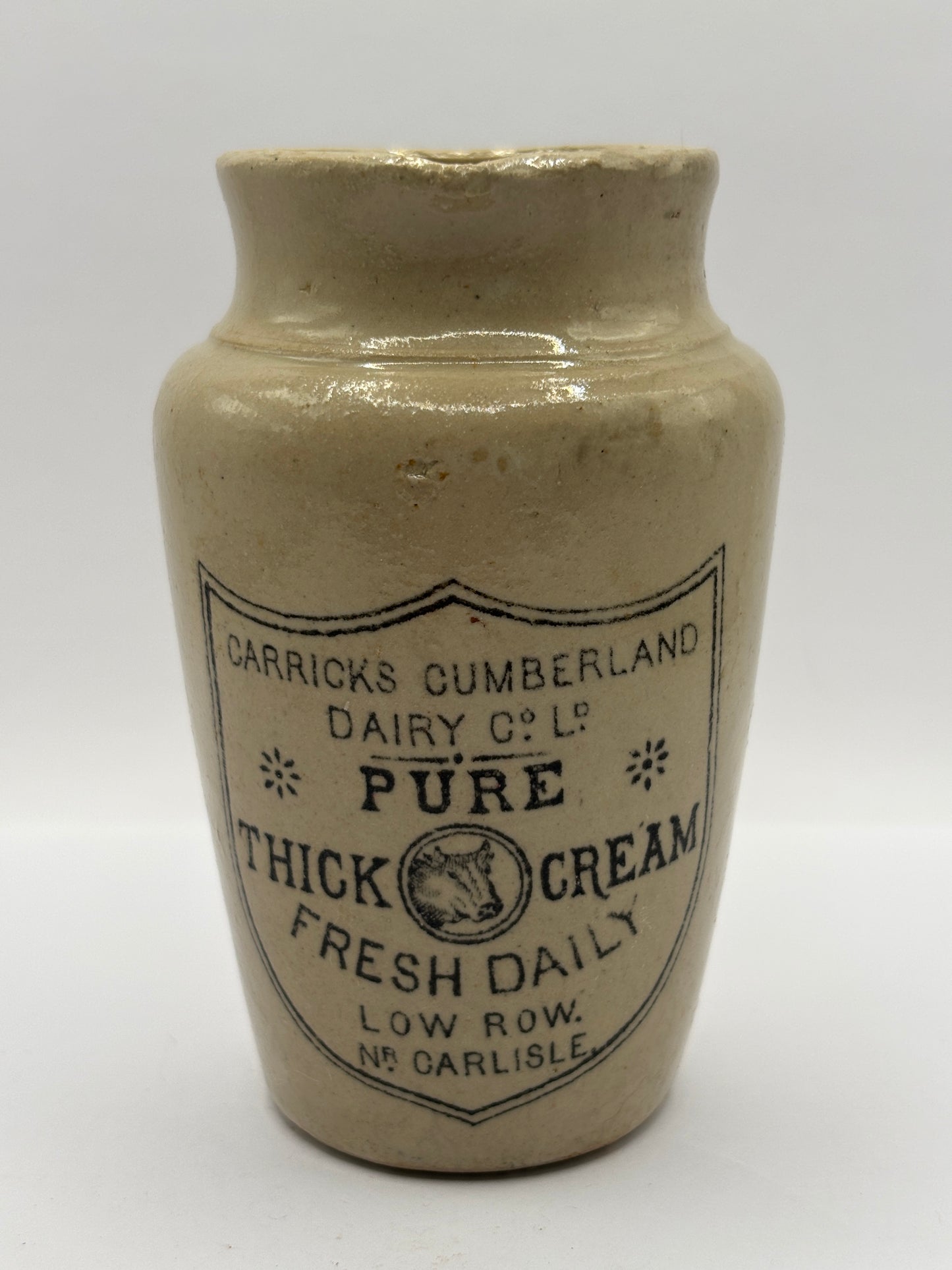 Old advertising cream pot, Carricks pure thick cream with handle. Black print 10cms