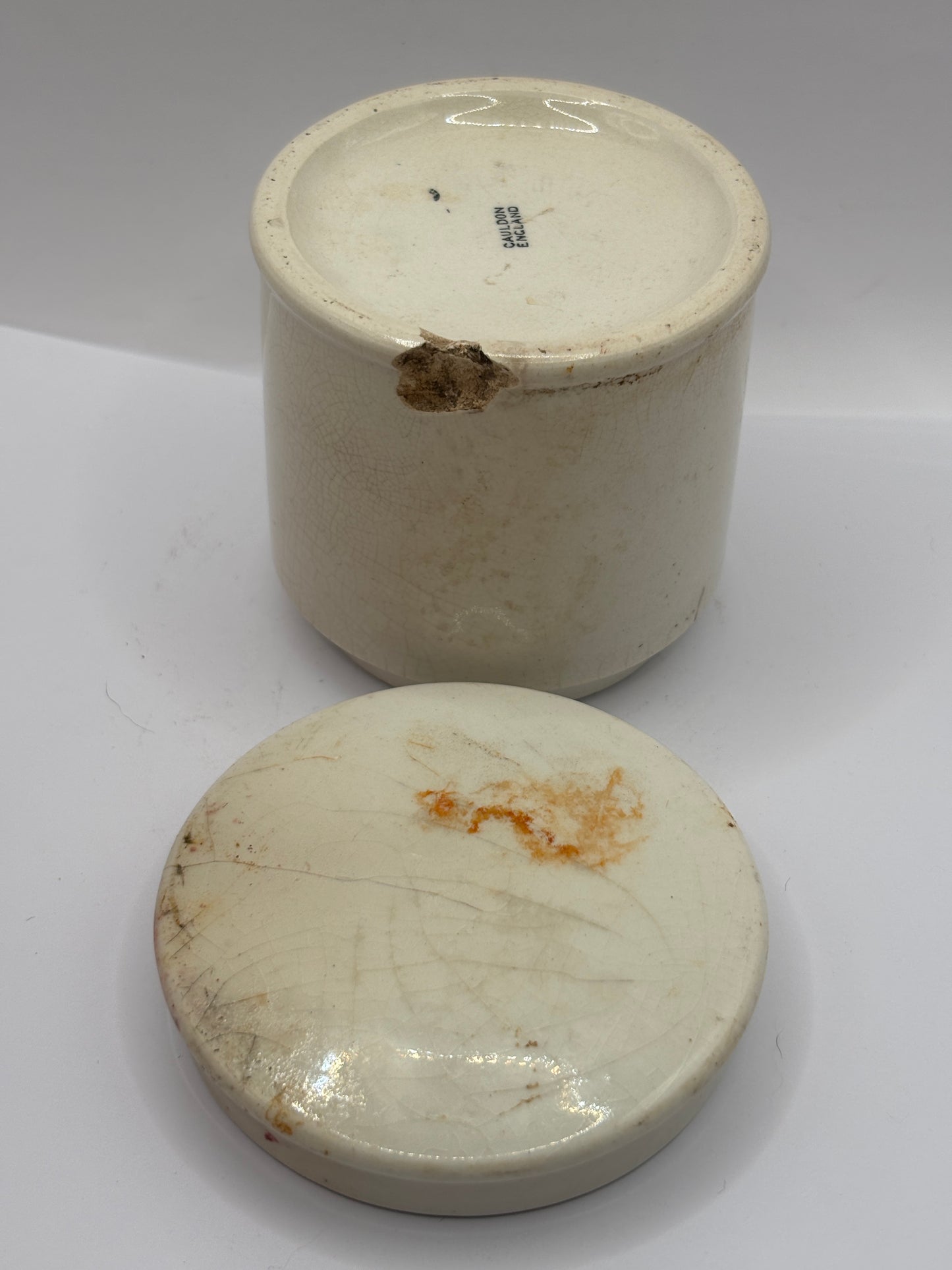 Old stoneware caviar jar and lid. Chipped
