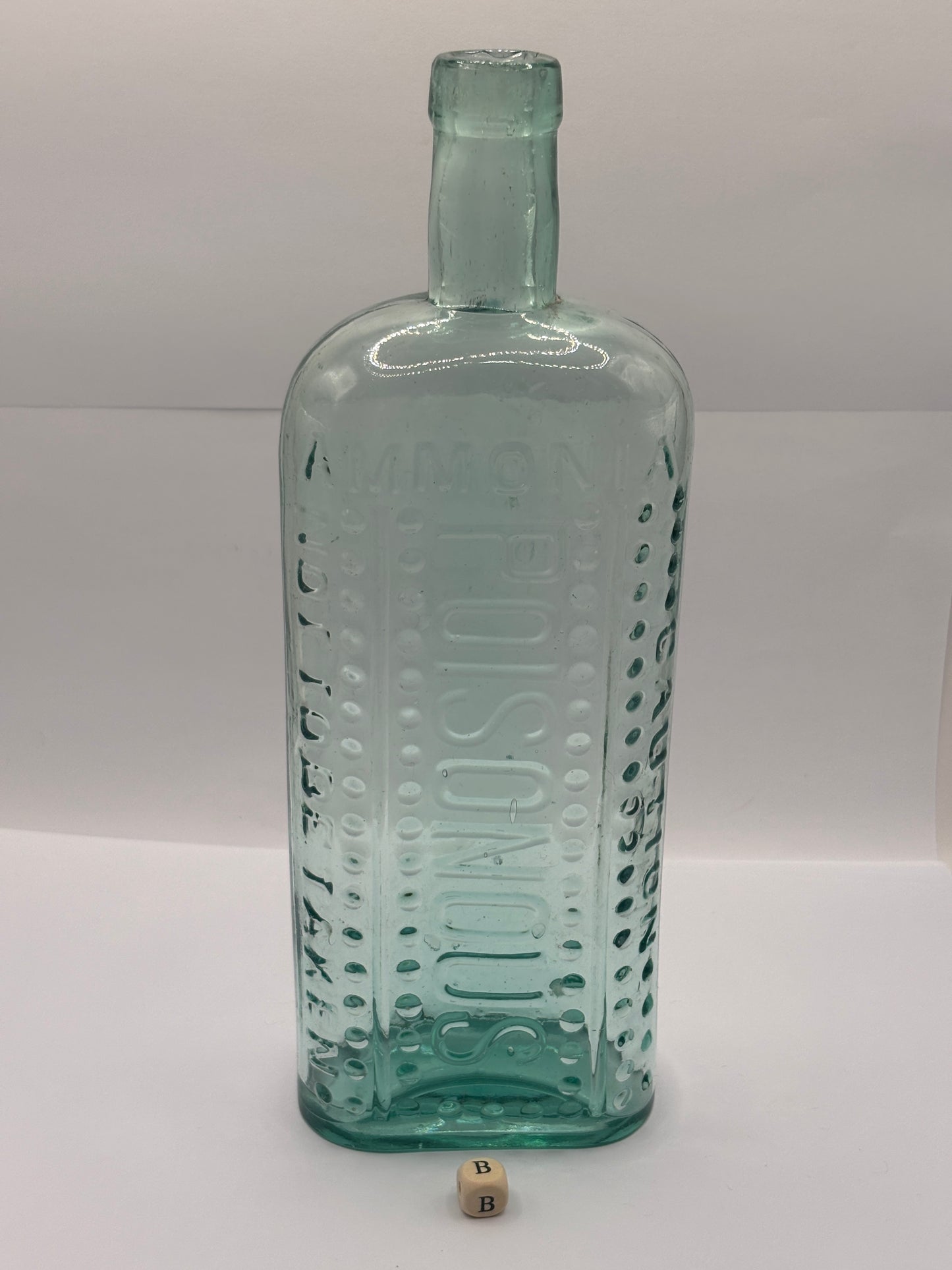 Old large aqua glass poison bottle, Poisonous (B) ammonia