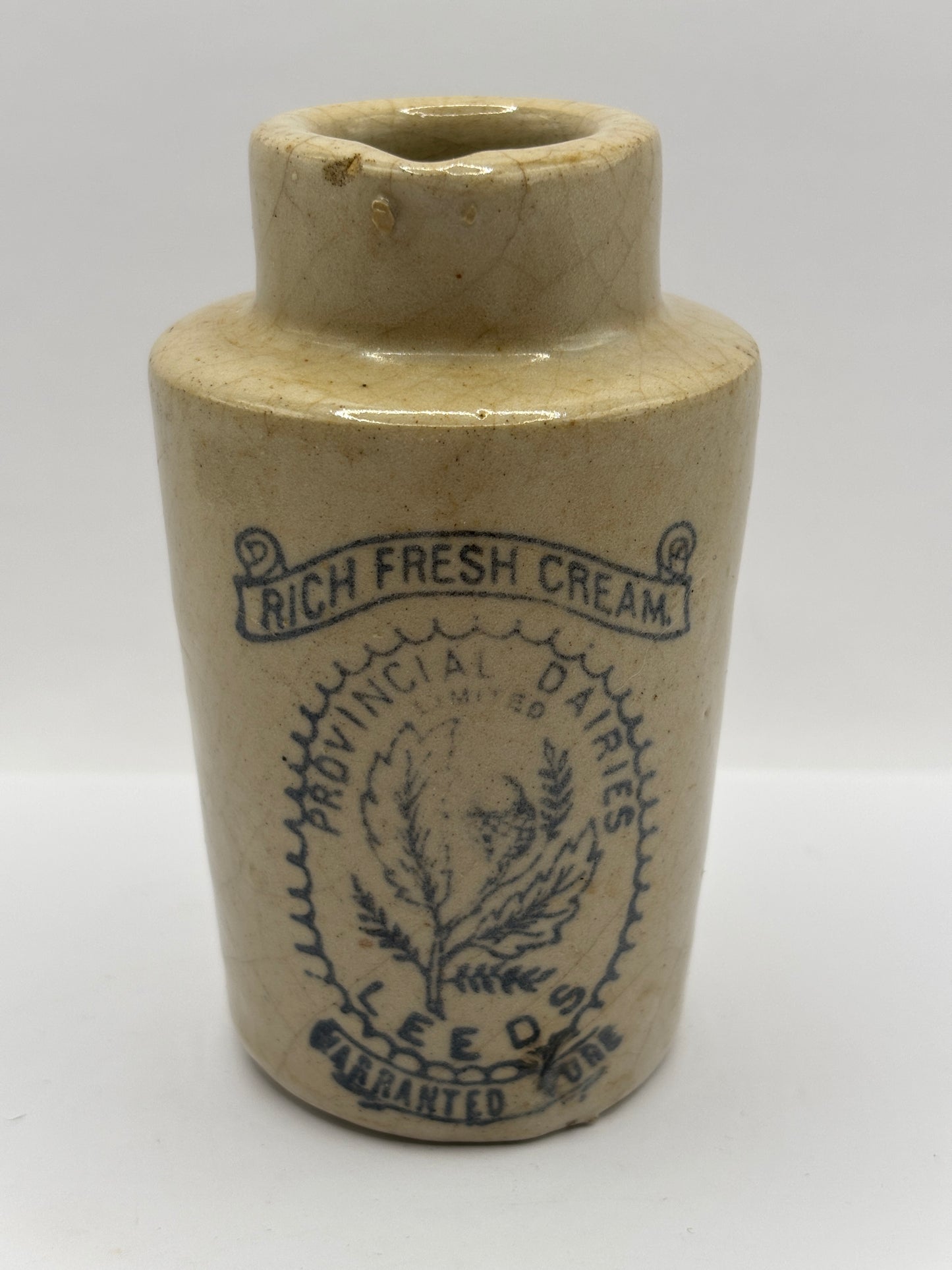 Old stoneware advertising cream pot. Provencial dairies Leeds