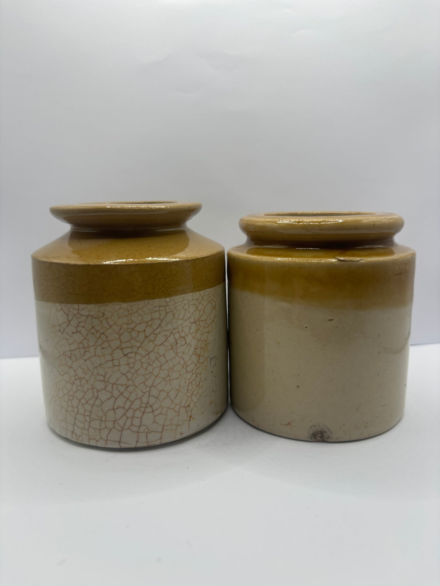 2 small stoneware jars