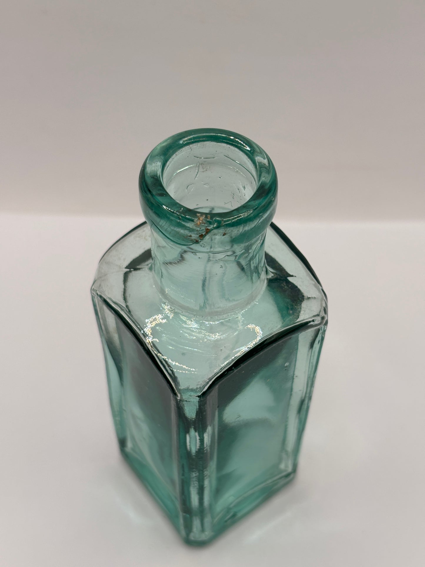 Old square aqua glass chemist bottle