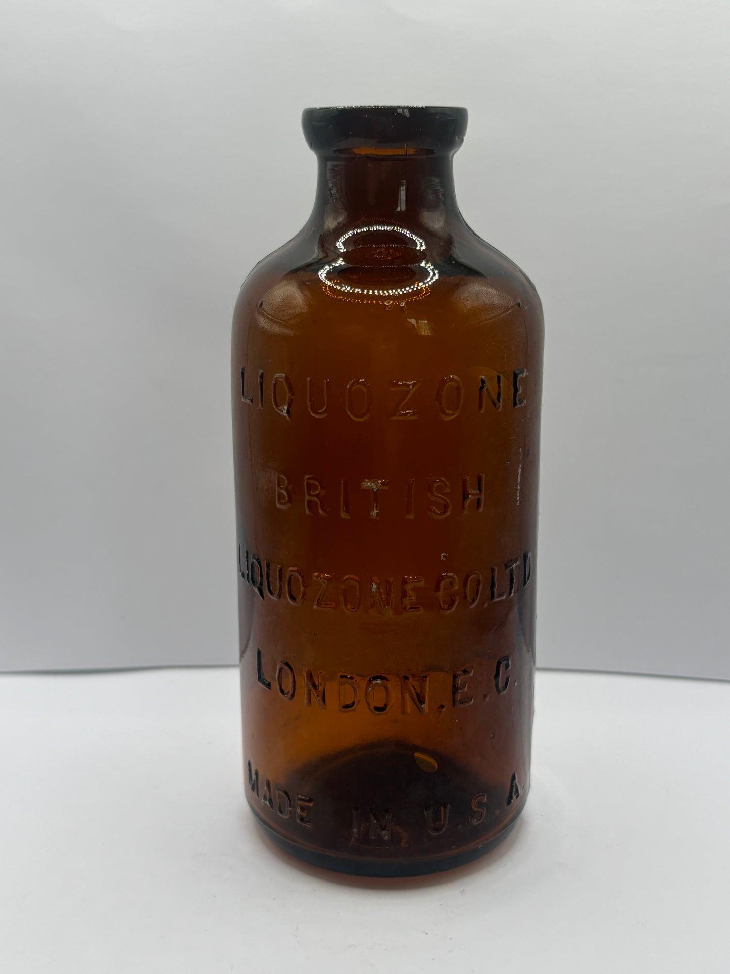 old amber glass liquozone bottle