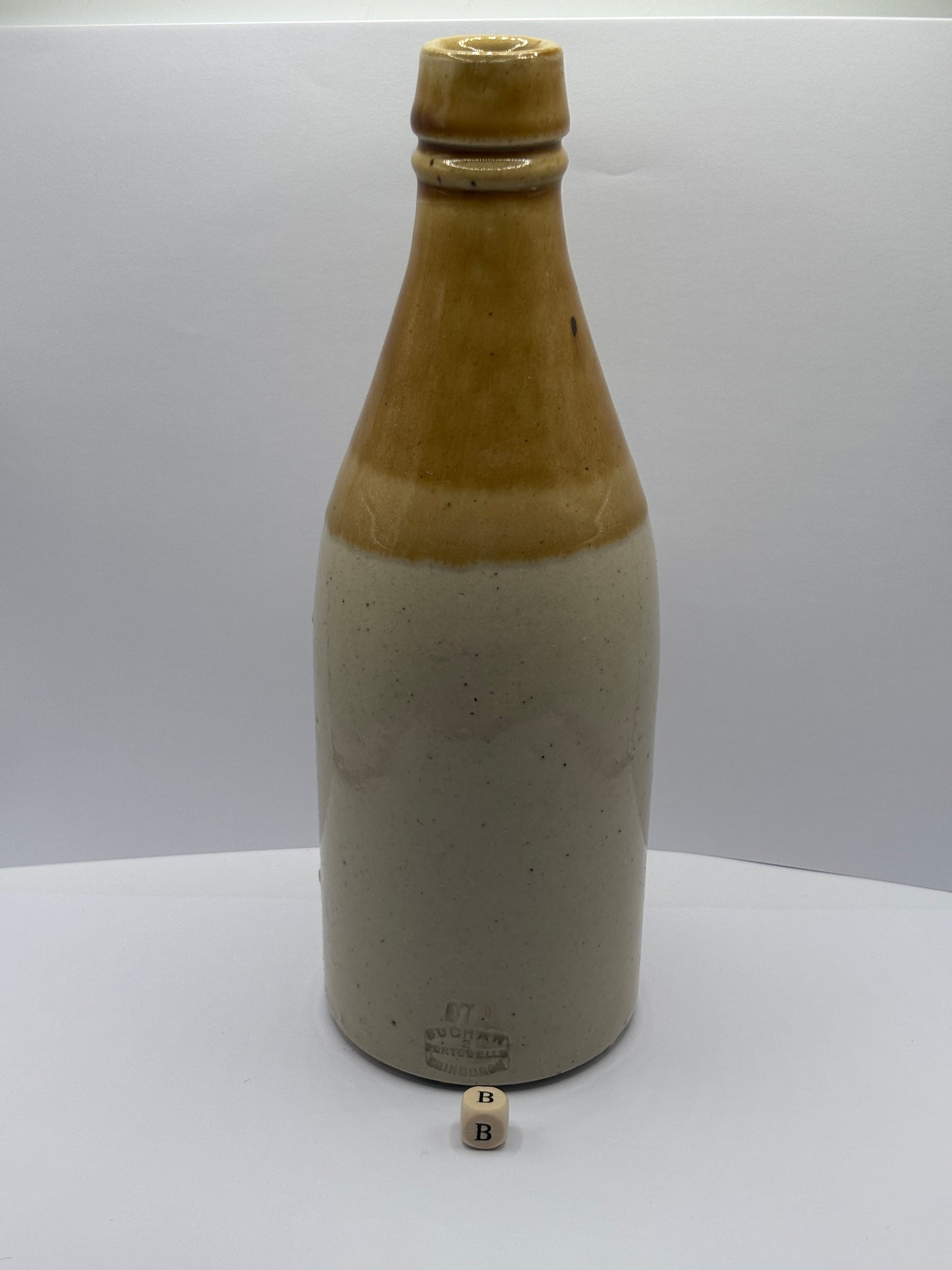 Old plain stoneware ginger beer bottle (B)