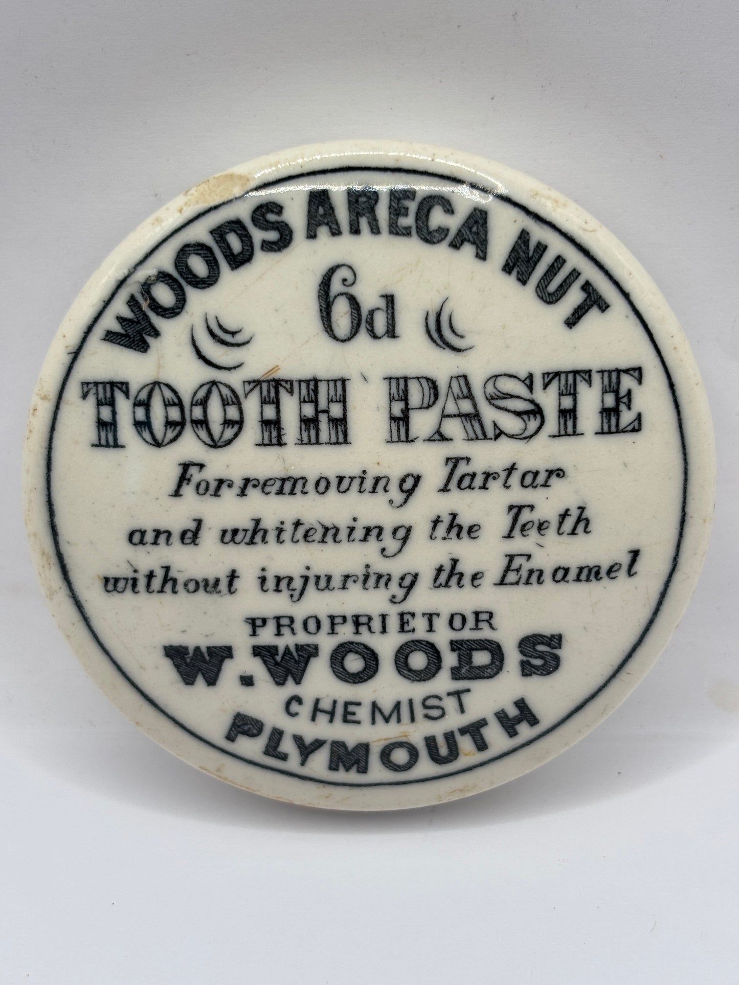 Old advertising lid, Woods areca nut tooth paste
