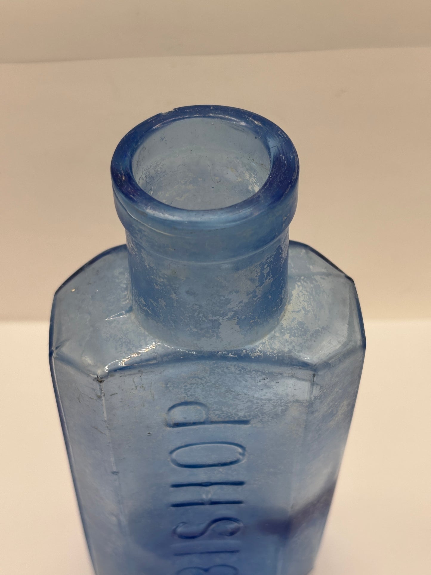 Old crusty blue glass advertising chemist bottle, Bishop