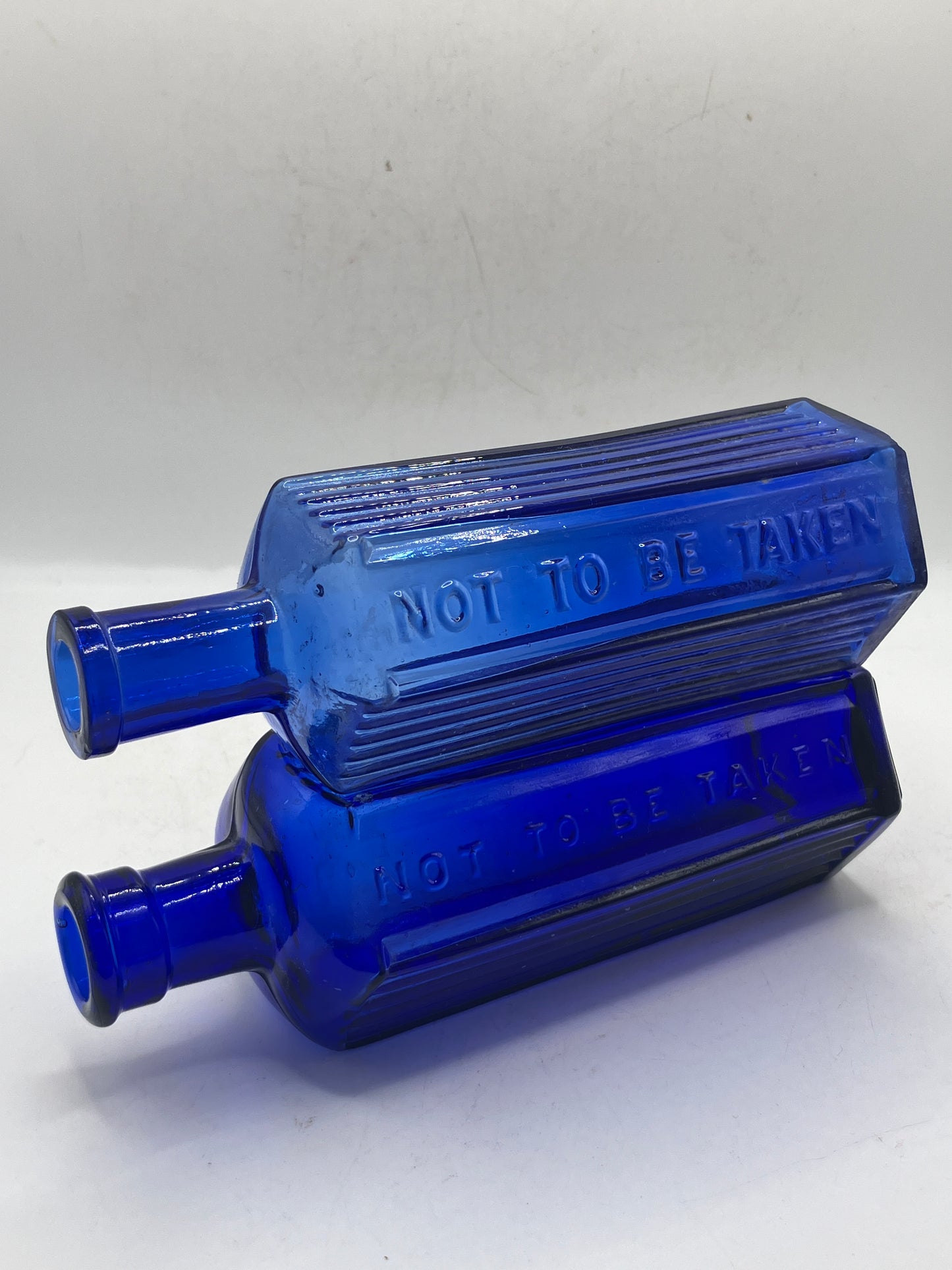 2 blue glass ribbed poison bottles, Not to be taken