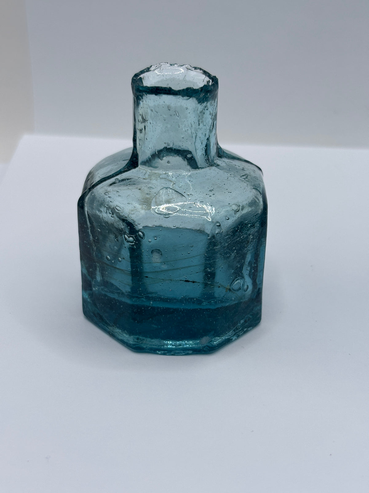 Old blue glass inkwell, ink bottle, penny ink with swirls