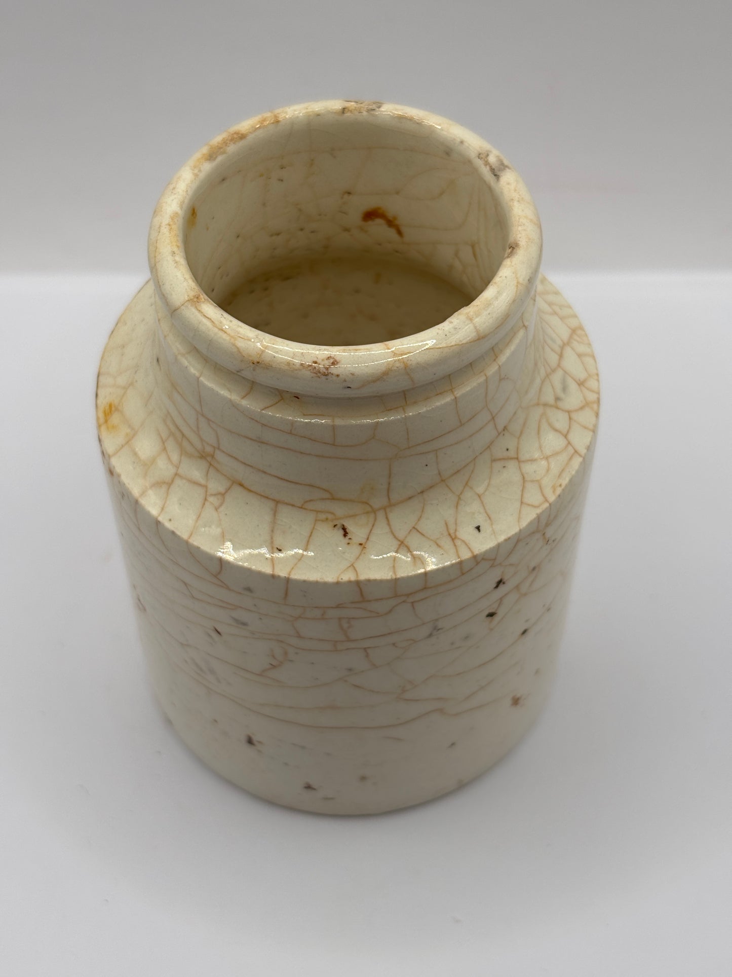 Old white stoneware jar, stained & crazed