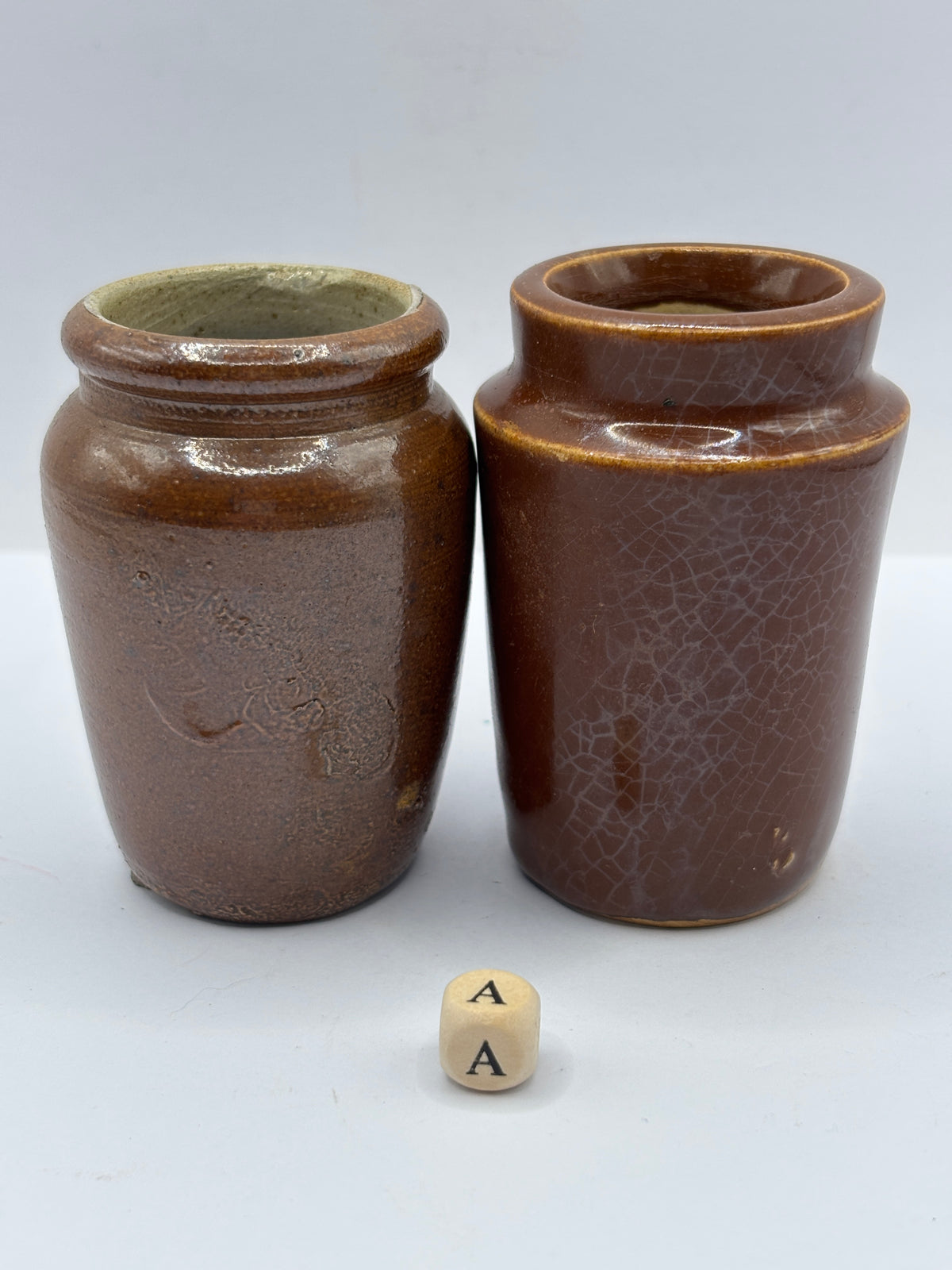 2 Old brown stoneware cream pots (a)