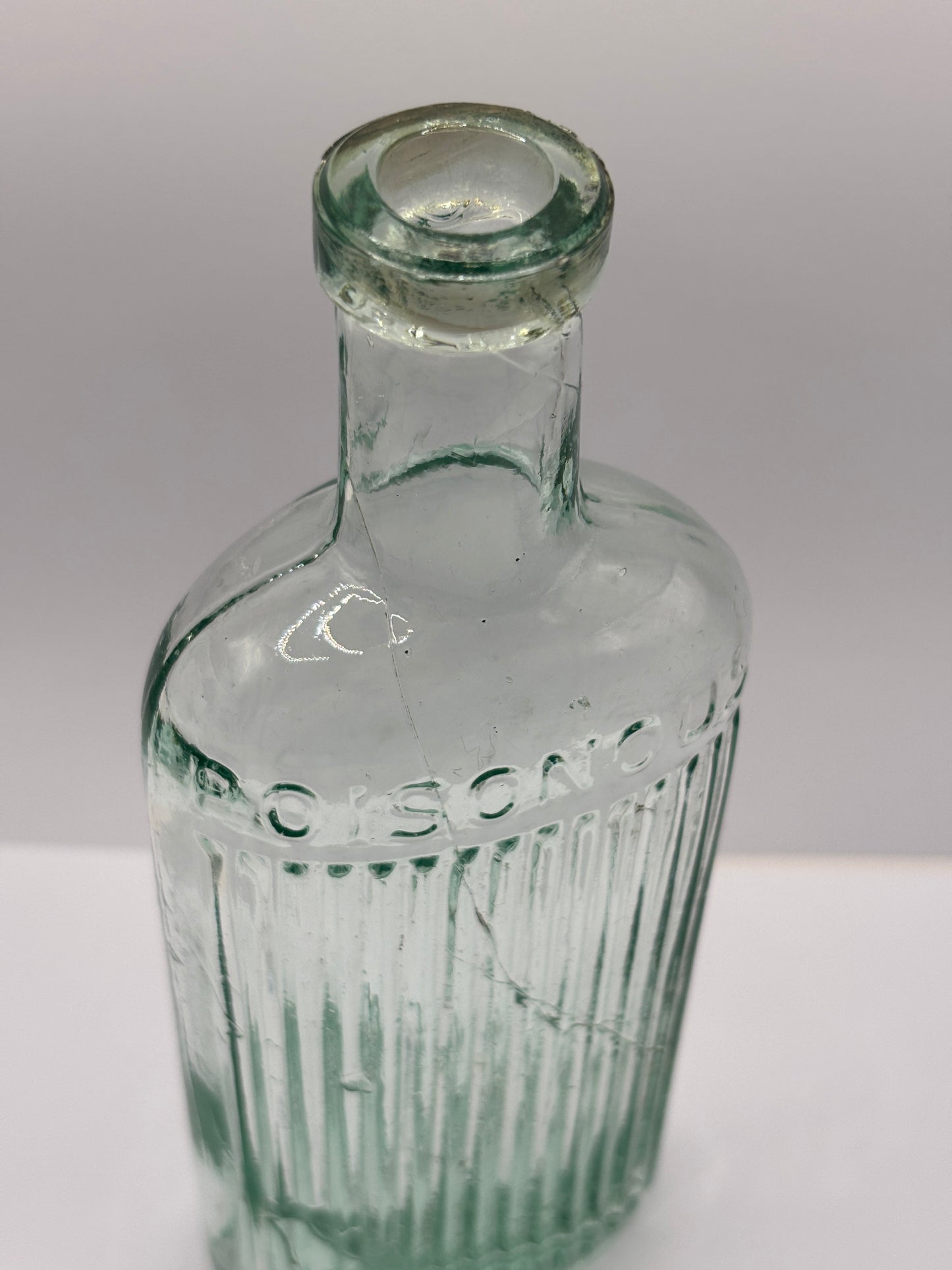 Old aqua glass poison bottle, Poisonous