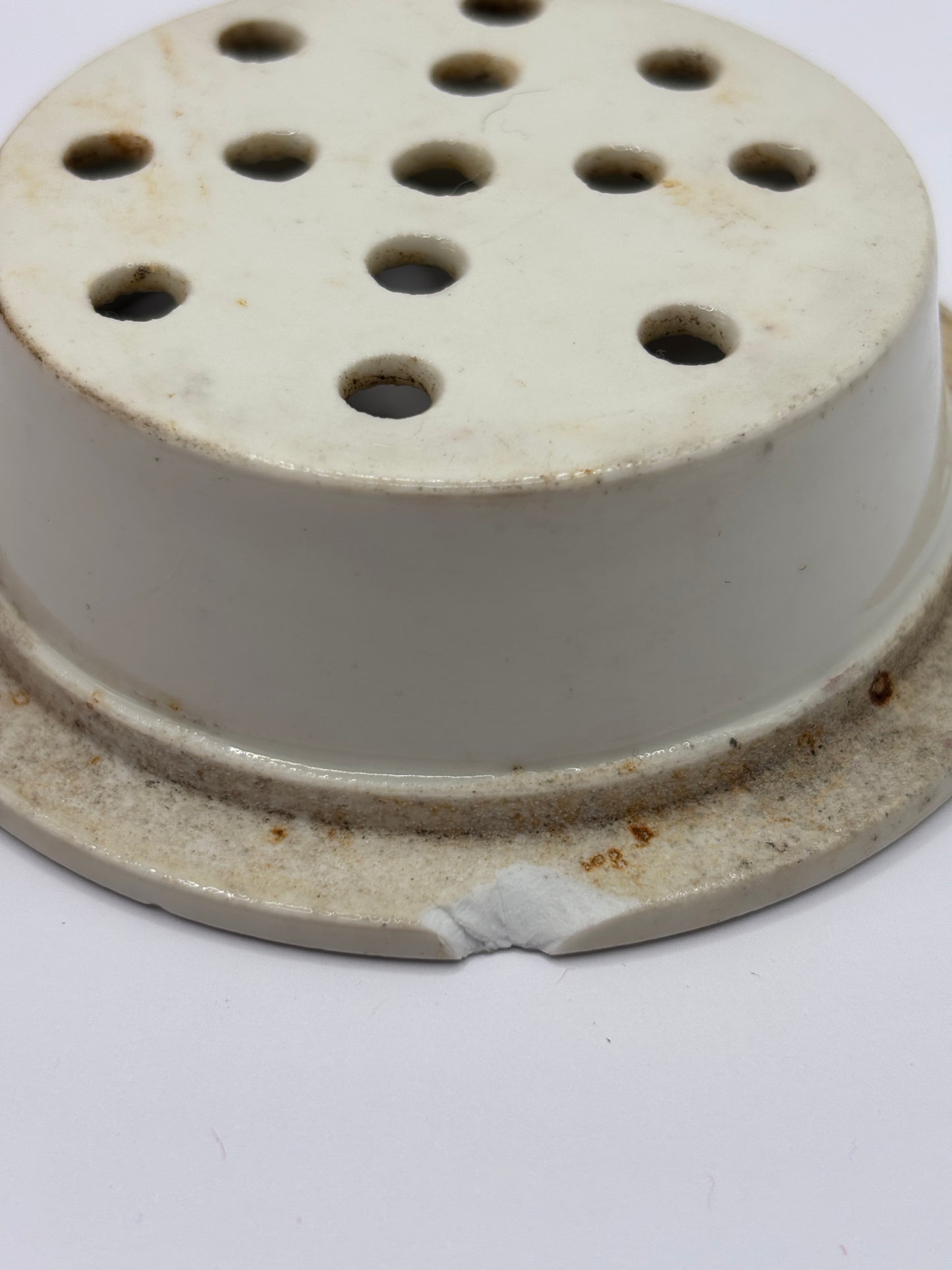Old stoneware strainer
