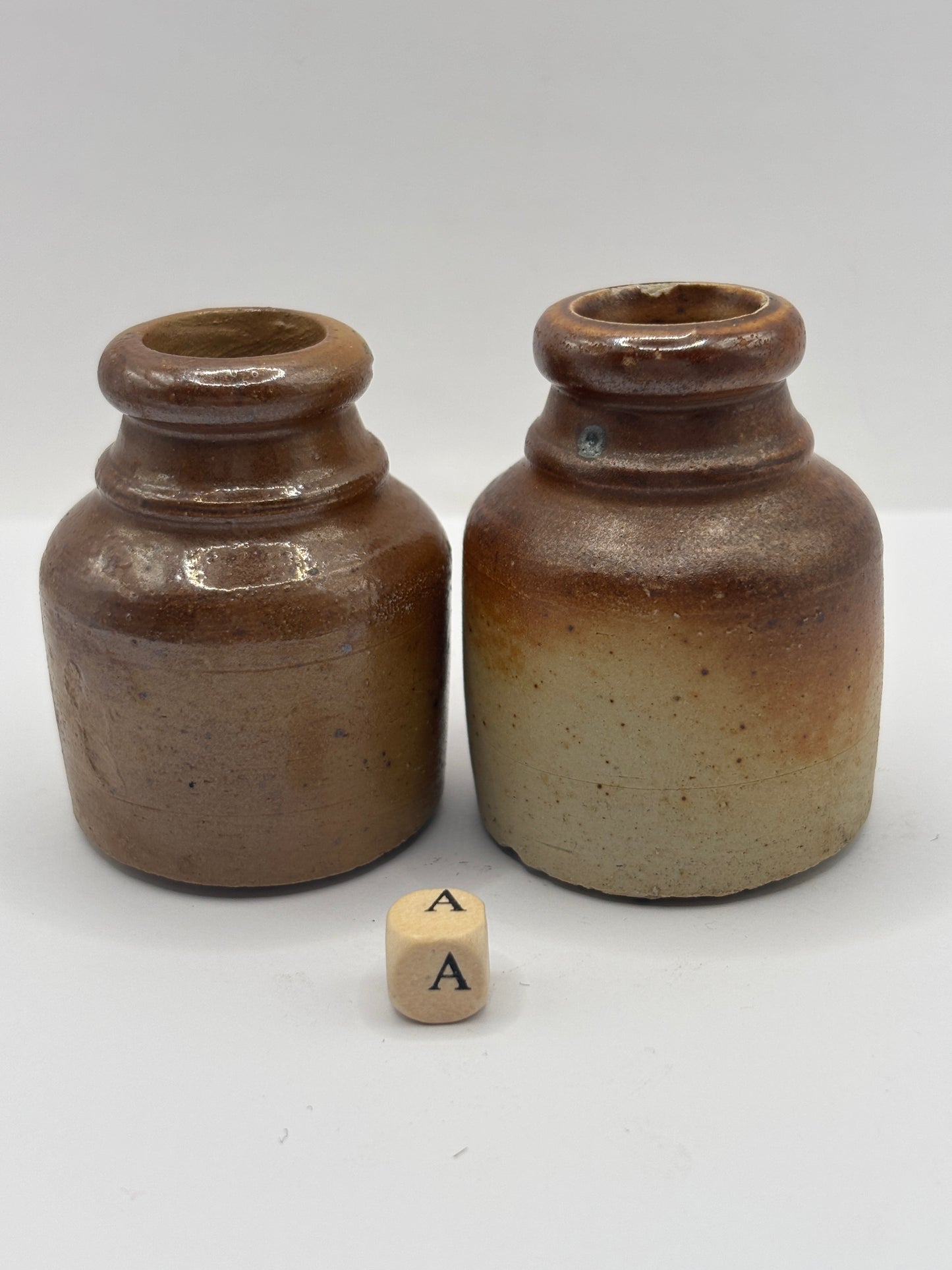 2 brown stoneware inkwells, ink bottles (a)
