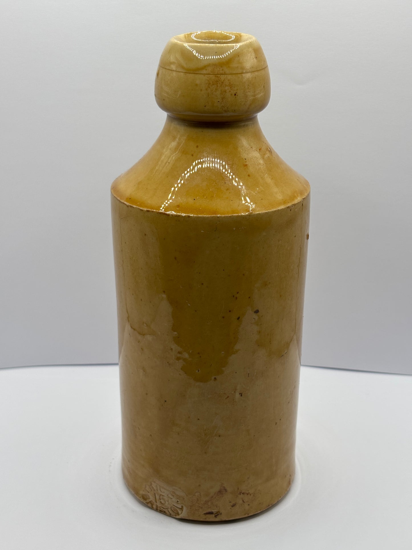 Old impressed stoneware ginger beer bottle, J.H Cuff Manchester