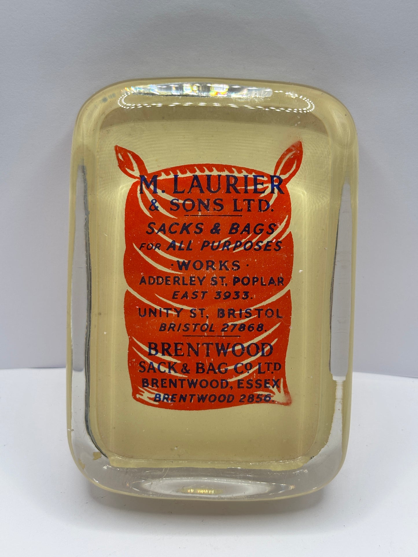 Old glass advertising paperweight. M.laurier & sons sacks & bags