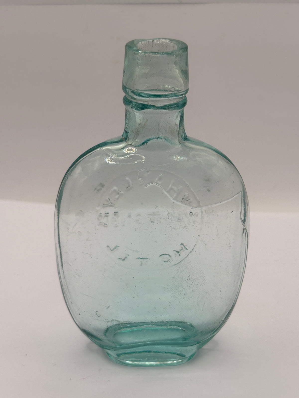 Old glass spirit flask, Whalley hotel