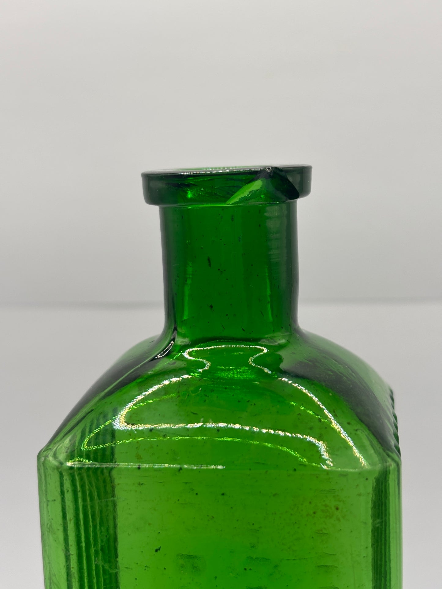 Old green glass poison bottle, Sheffield corporation poison bottle. Chipped