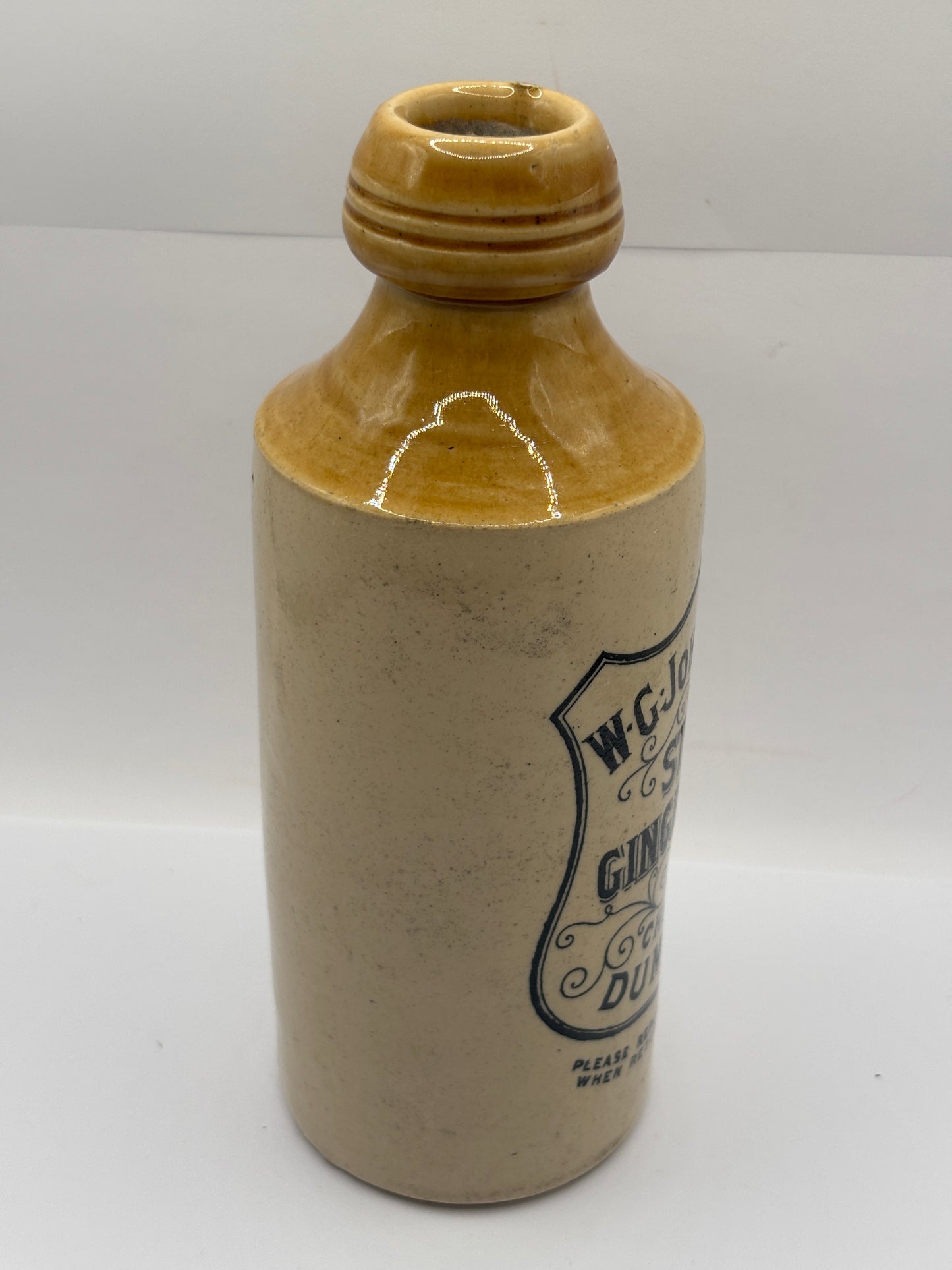 Old stoneware ginger beer bottle, W.G Johnstone chemists Dumfries
