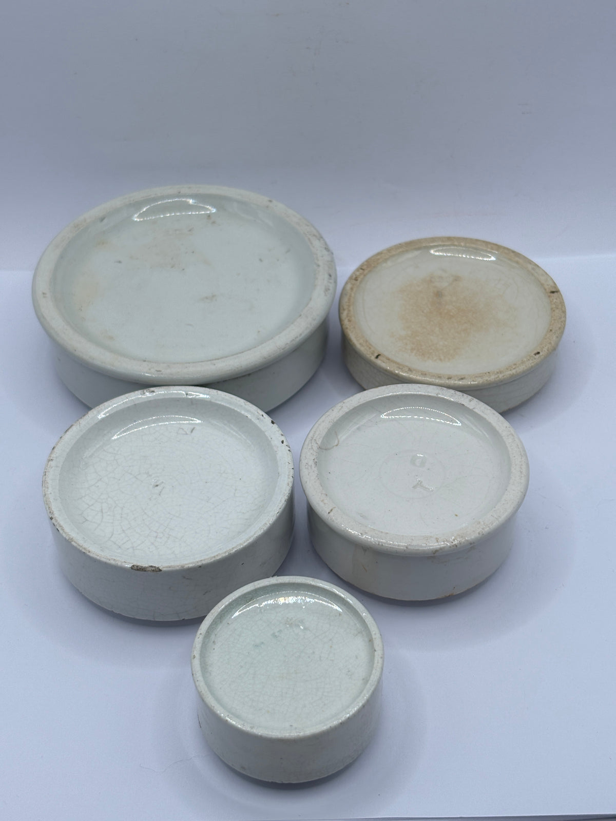 5 old stoneware pot lid bases, stackers (G)