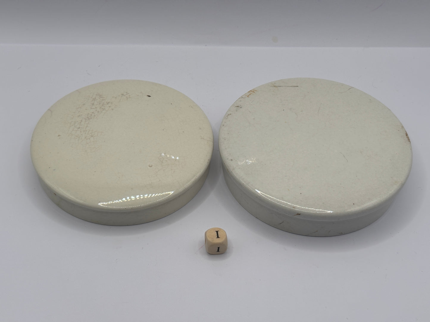 2 old plain stoneware lids (i)