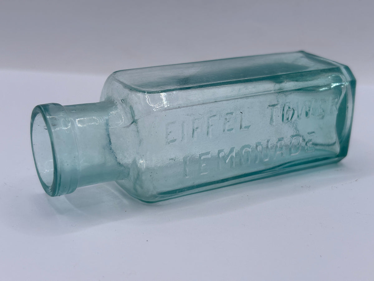 Old aqua glass advertising bottle, Eiffel tower Lemonade