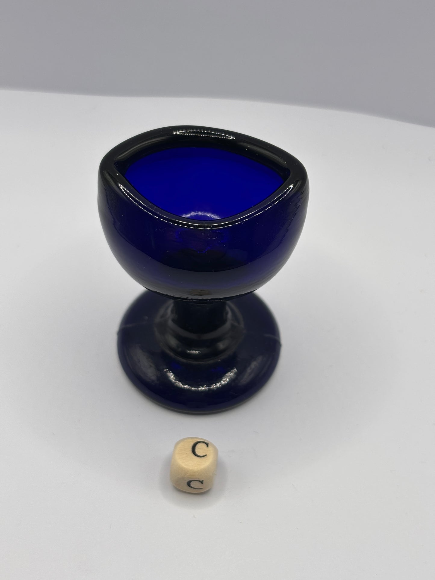 Old blue glass eye bath (c)