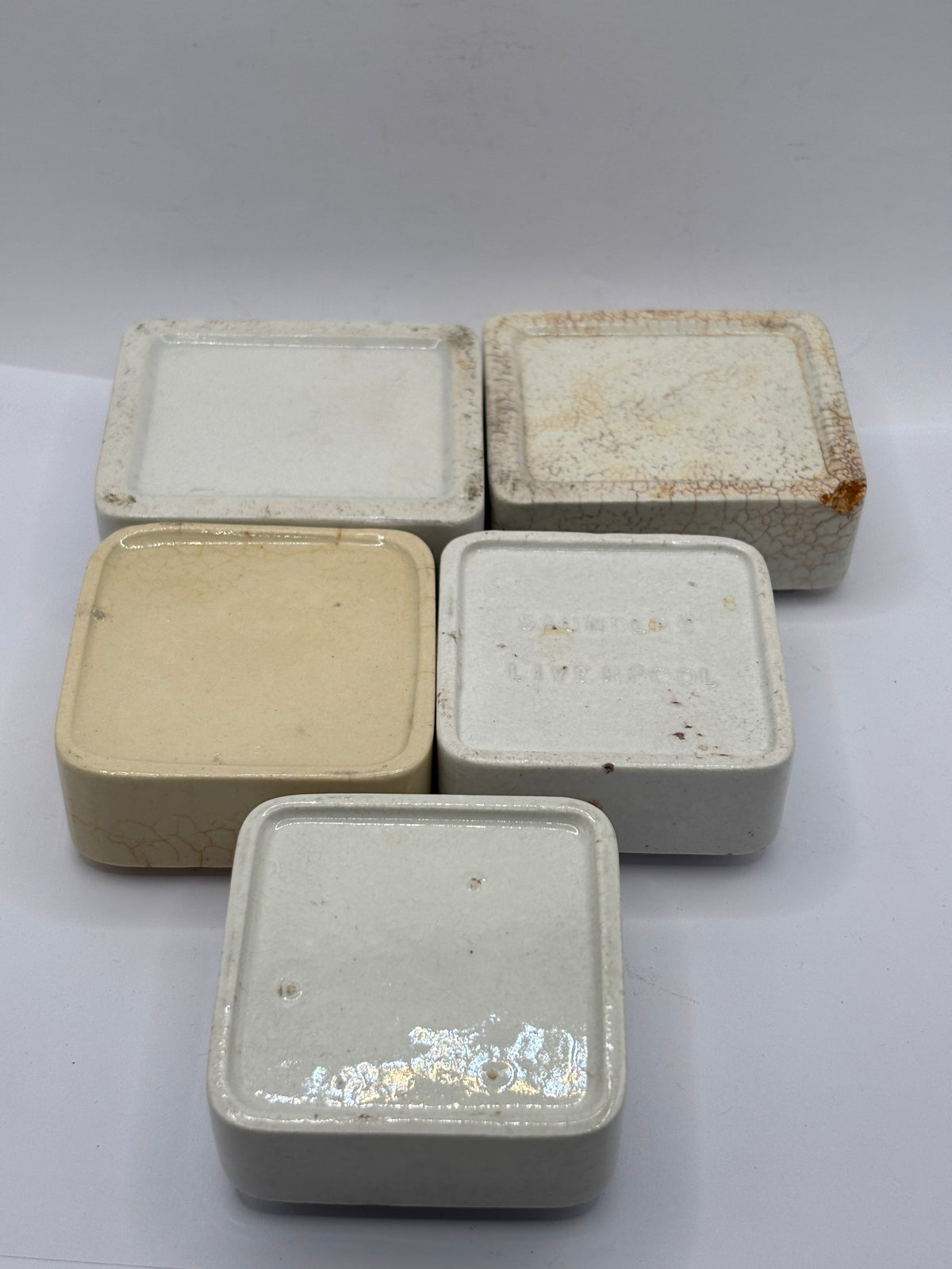 5 old square stoneware pot lid bases, stackers