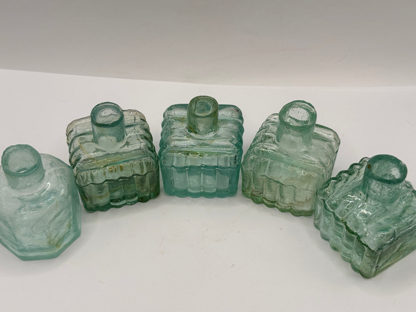 5 old aqua glass inks swirly inks, inkwells, ink bottles, penny ink.