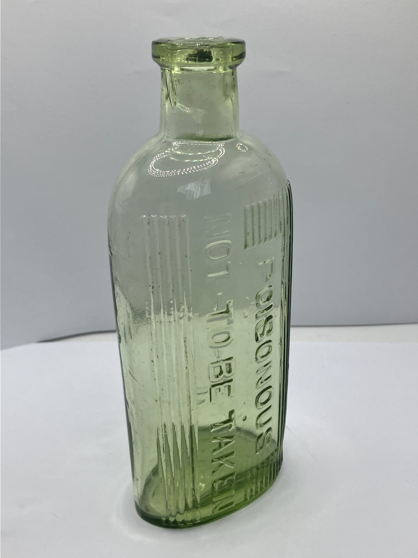 Green glass poison bottle, poisonous not to be taken