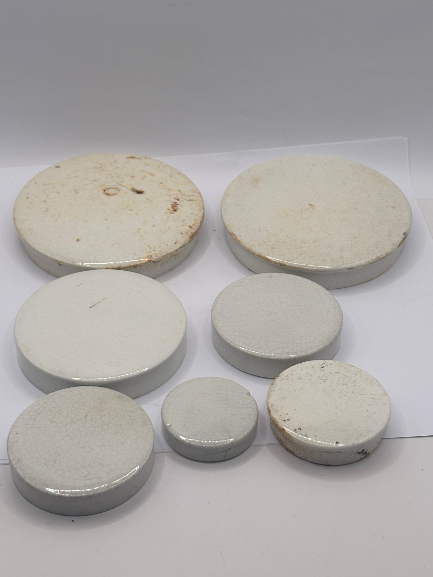 7 old plain stoneware lids, stacking lids (D)