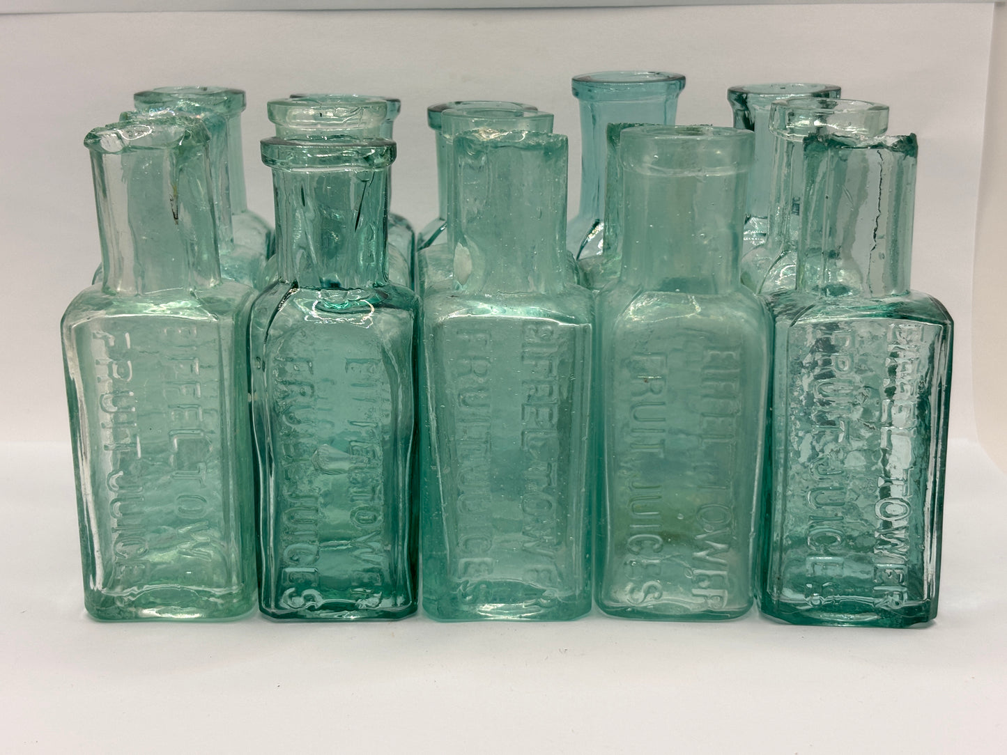 15 old Eiffel tower lemonade bottles