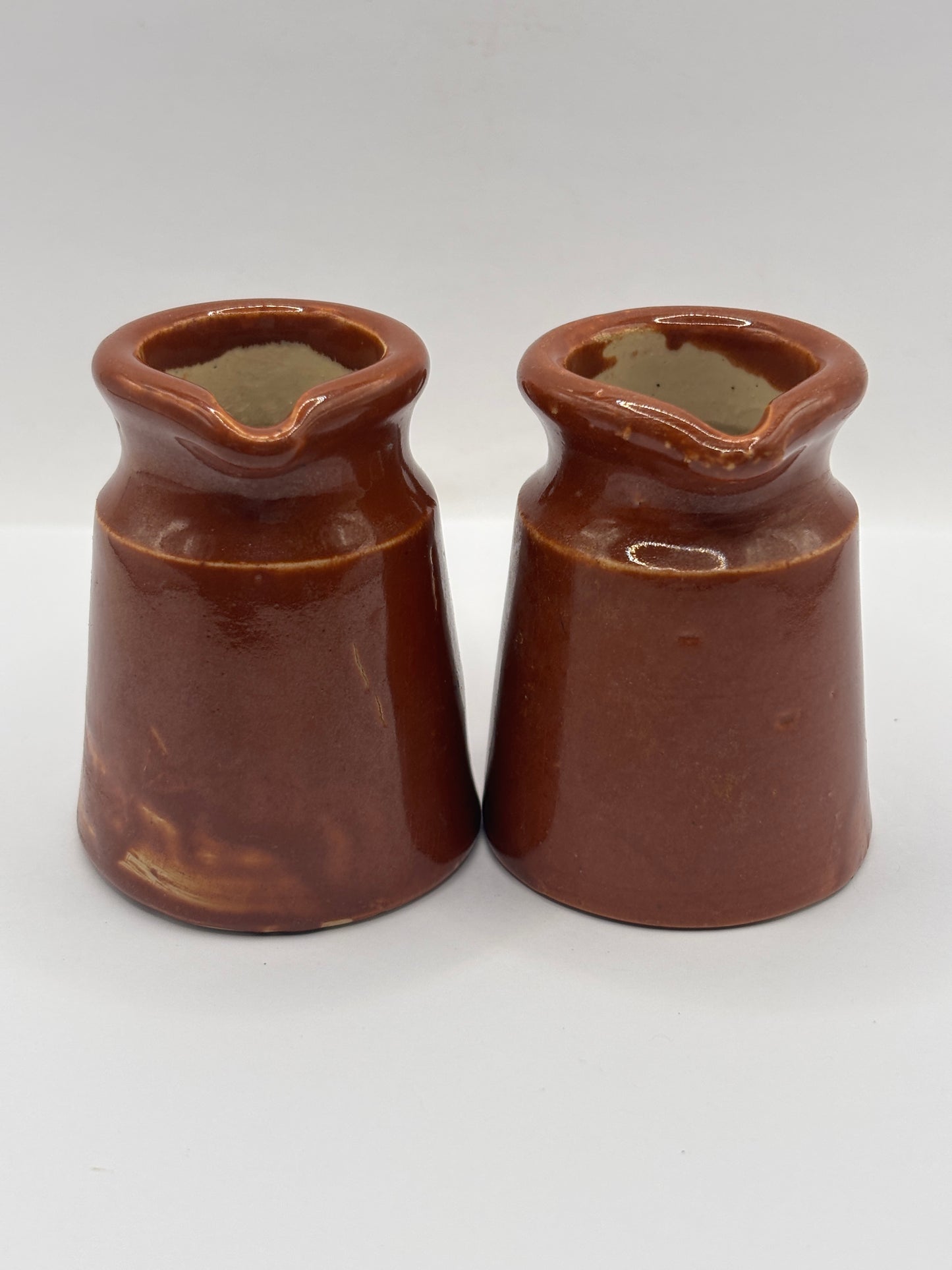 2 old small brown stoneware cream pots, pouring cream