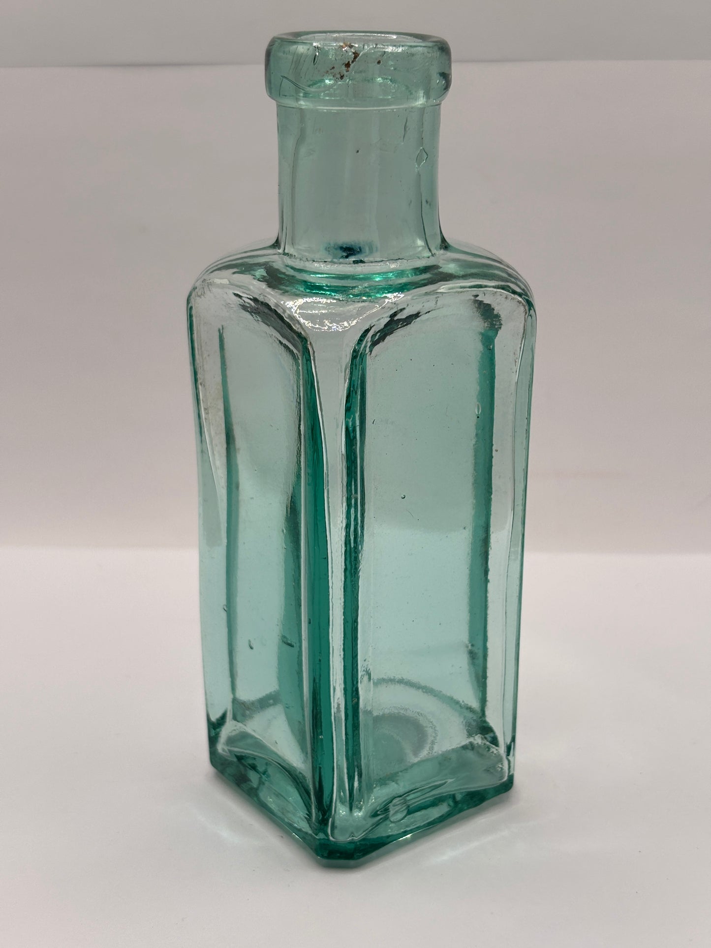 Old square aqua glass chemist bottle