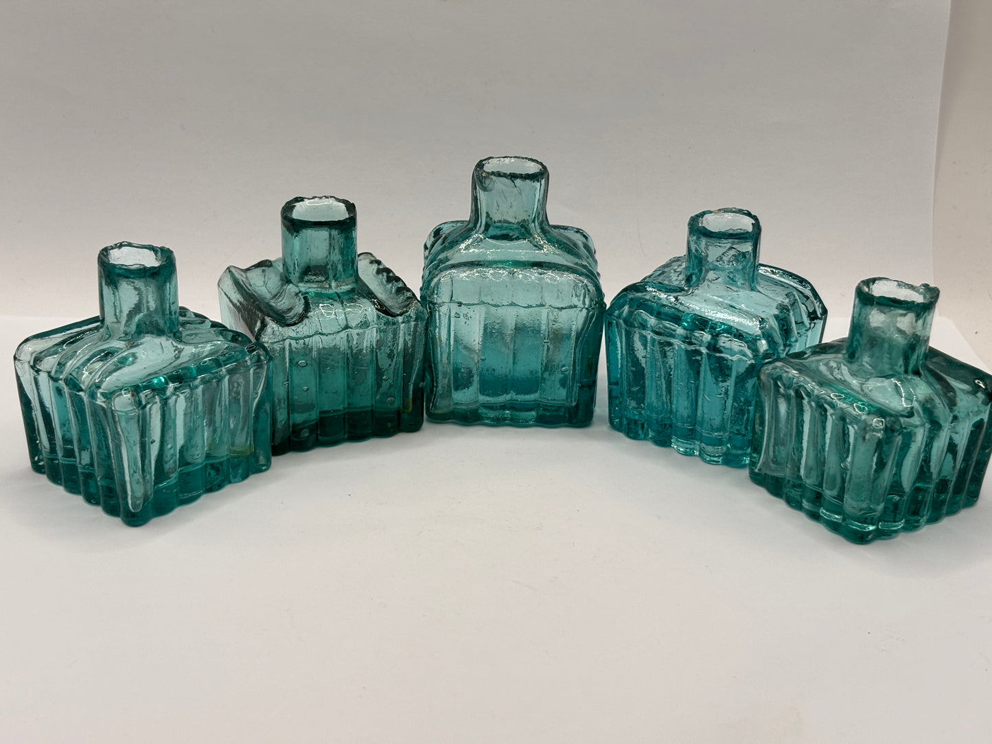 5 old glass ribbed inks, inkwells, ink bottles. Dark aqua