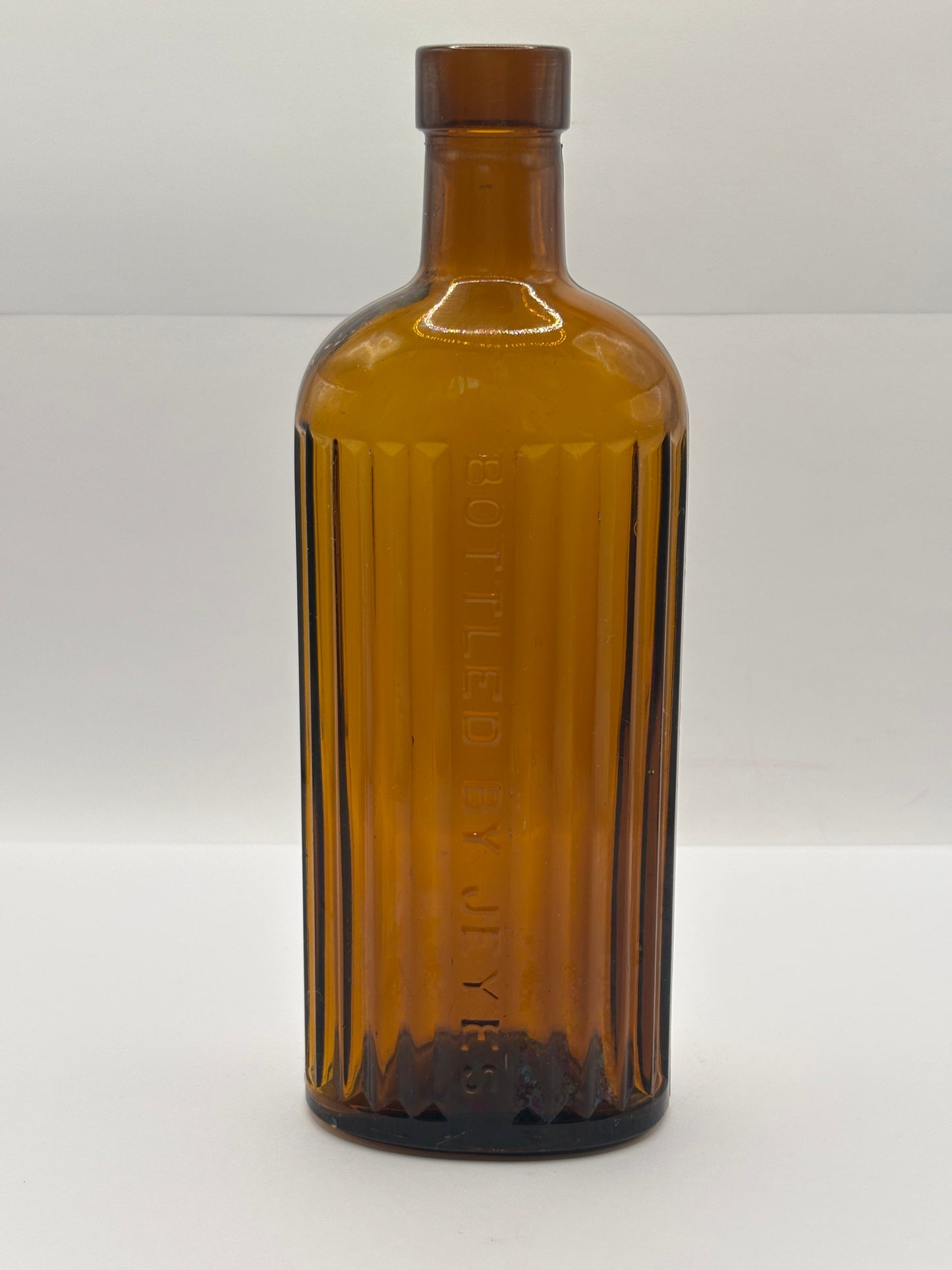 Old amber glass Jeyes fluid bottle