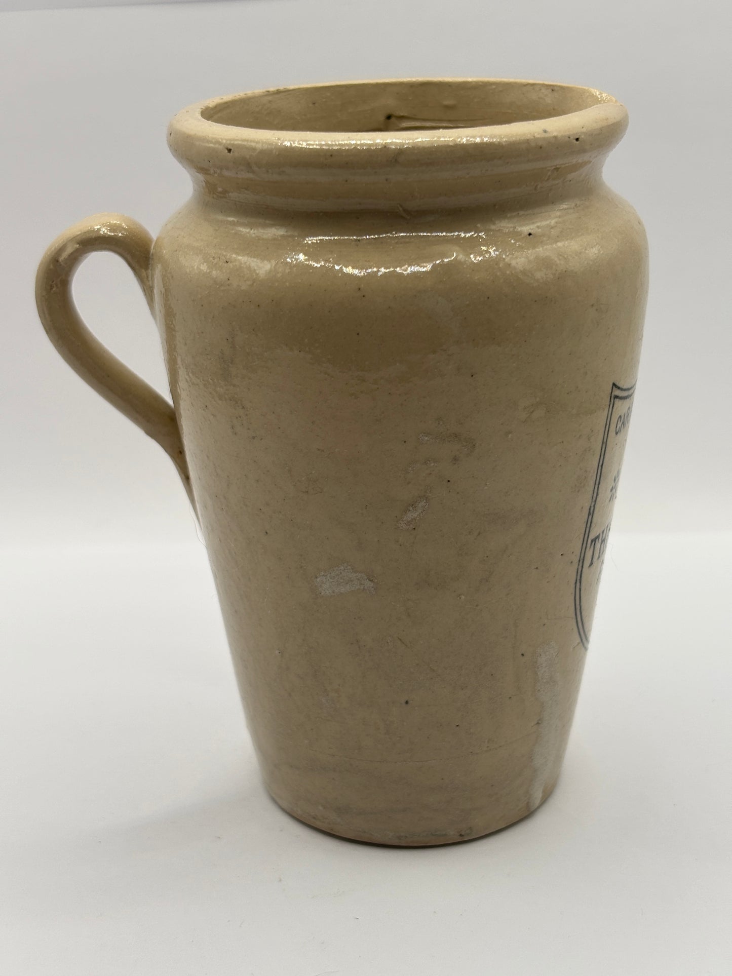 Old large advertising cream pot, Carricks pure thick cream with handle. Black print 11.5cms
