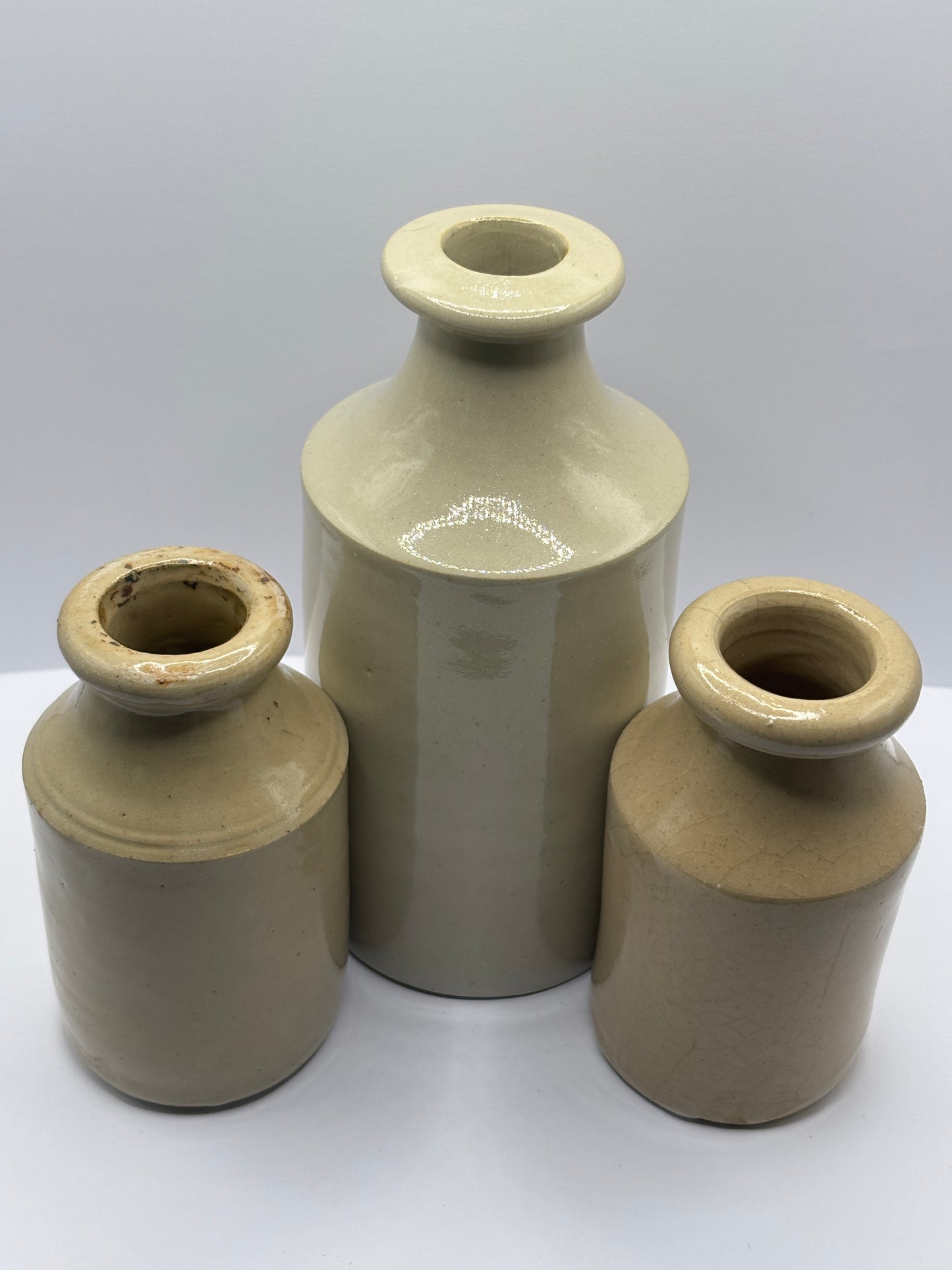 3 old stoneware furniture cream bottles, vase