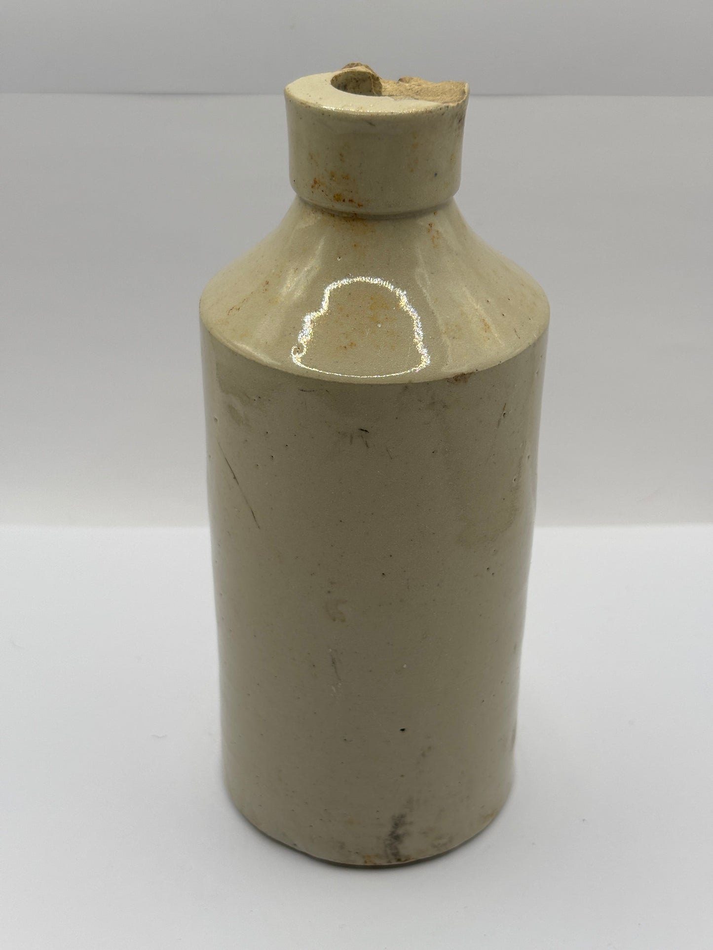 Old stoneware Fish & Ring brand advertising bottle. Damaged