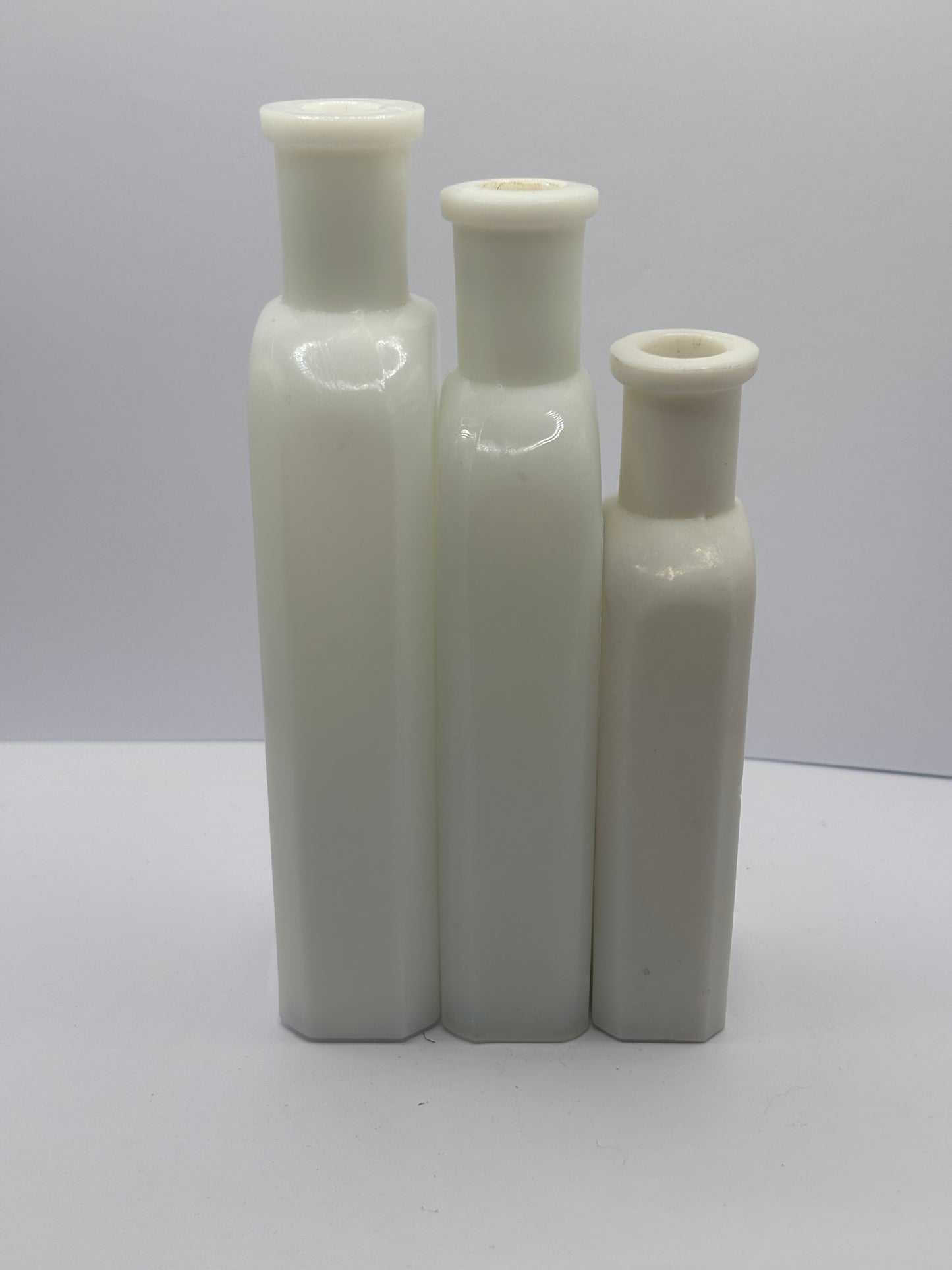3 old white milk glass bottles