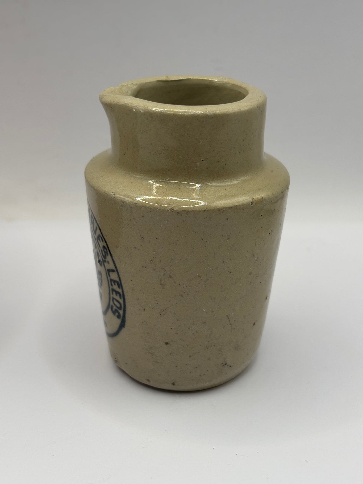 Old advertising cream pot, Provinical dairies Leeds. Chipped