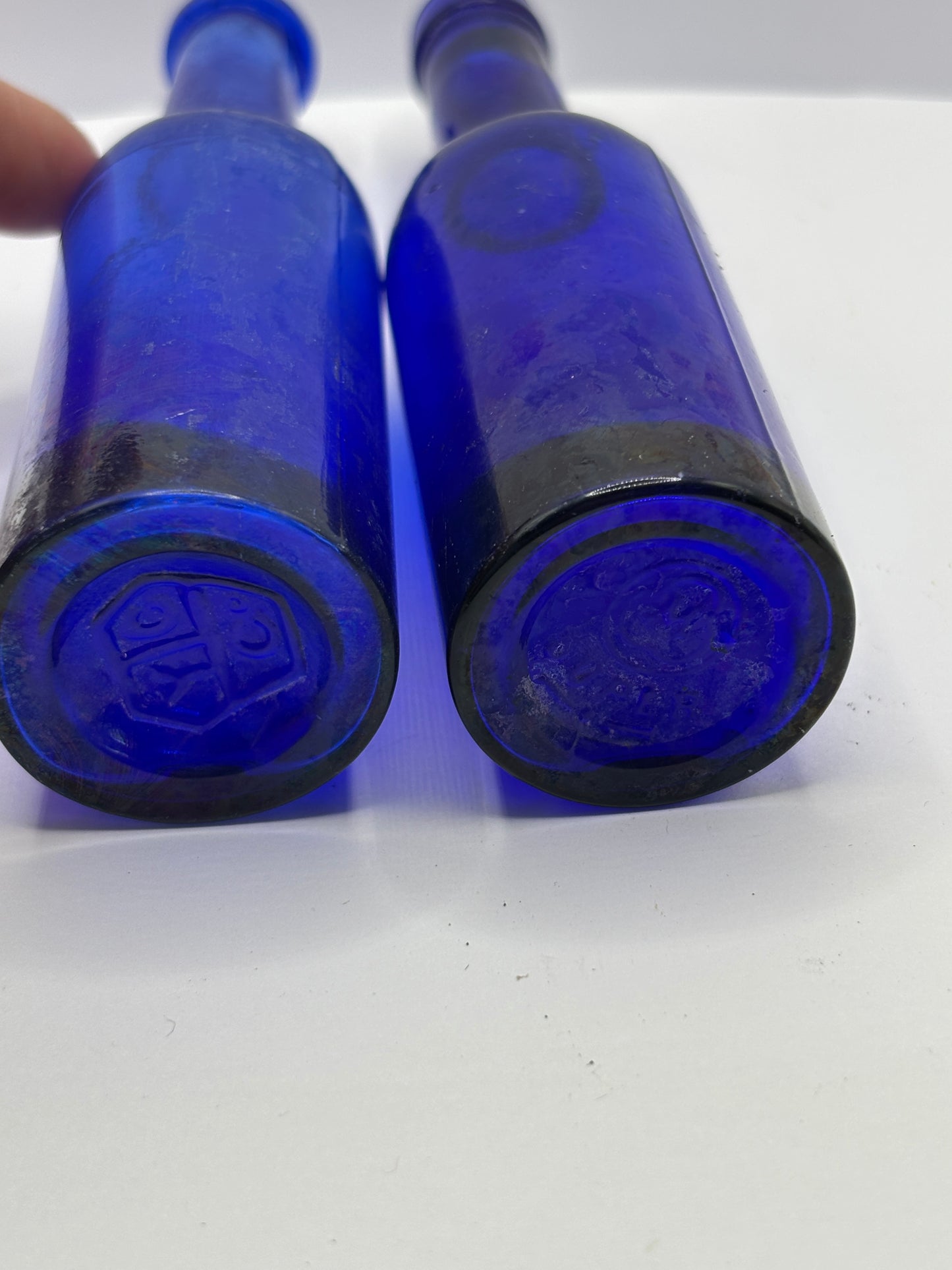 2 old blue castor oil bottles