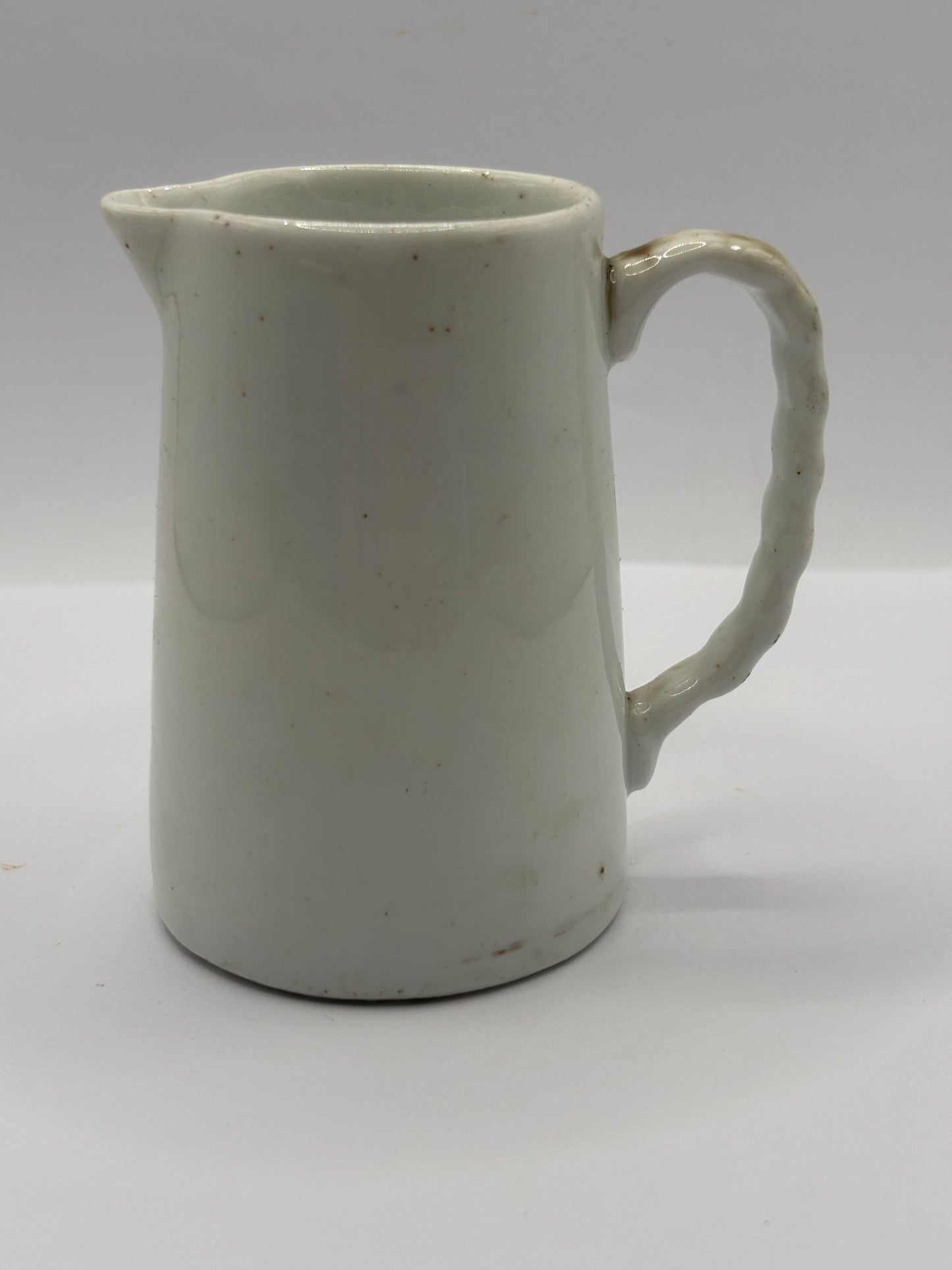 Old small white jug. 8cms