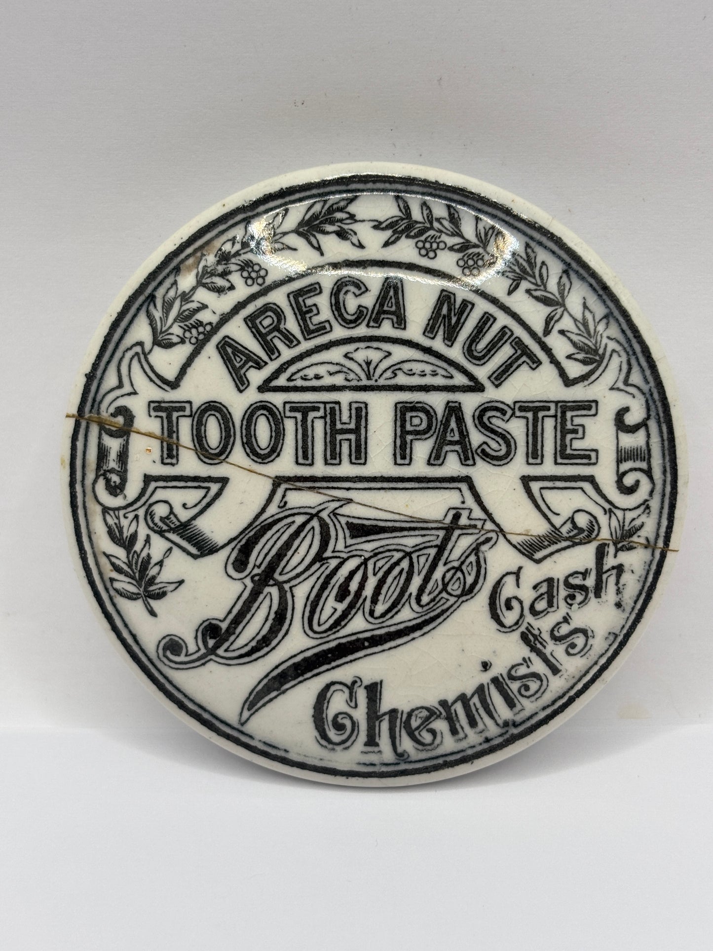 old advertising lid, areca nut tooth paste. Damaged